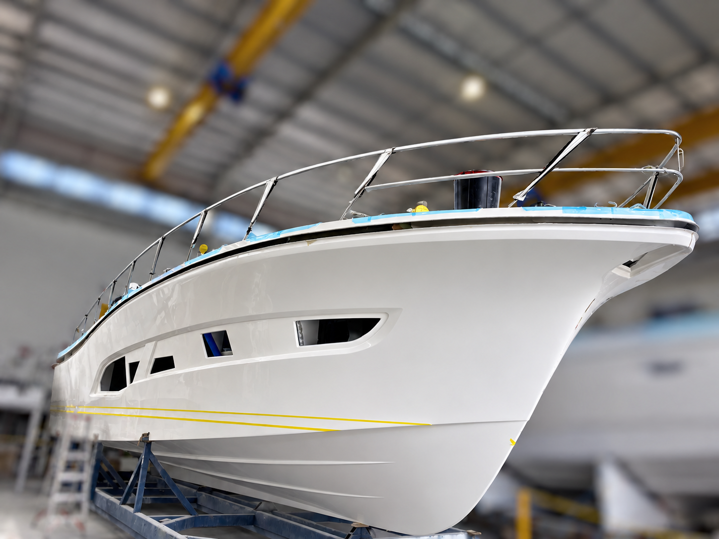 Luxury motor yacht hull and deck joining during professional boatbuilding construction on the Gold Coast