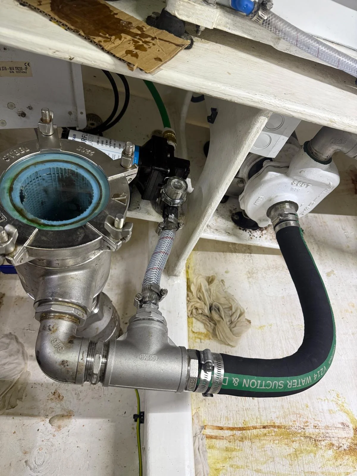 Plumbing and service area inspected for water leaks and water ingress aboard a vessel during inspection