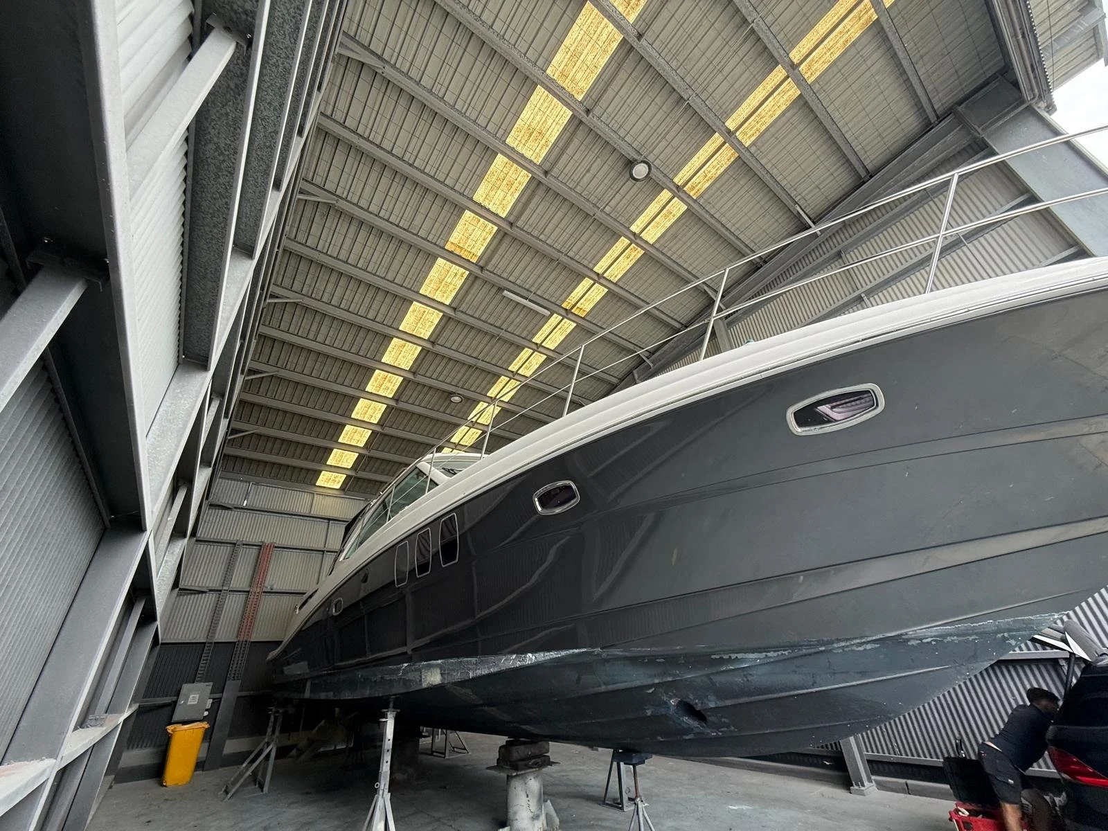 Sea Ray 515 Sundancer motor yacht hauled out for shipwright repairs, maintenance and new hull paint at Gold Coast City Marina