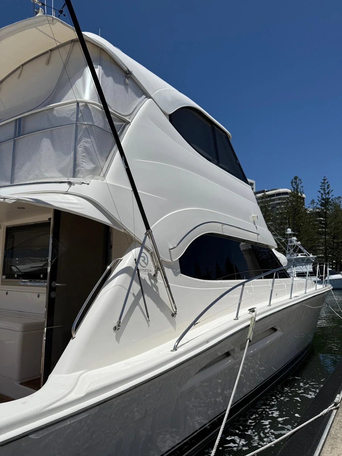 Riviera flybridge motor yacht undergoing professional boat wash, detailing and vessel care on the Gold Coast