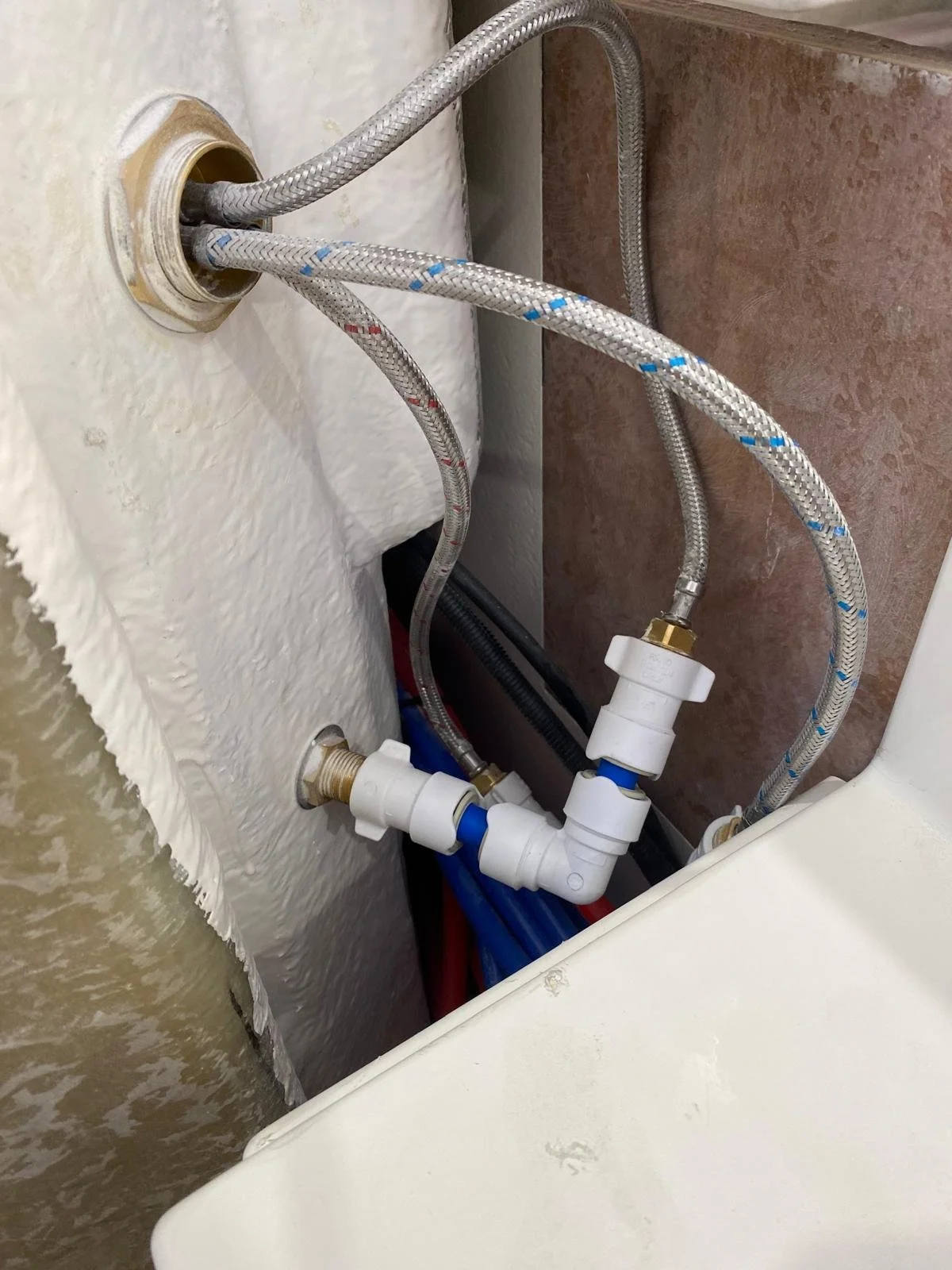 Marine plumbing inspected to identify potential leak points and unnecessary connections aboard a motor yacht