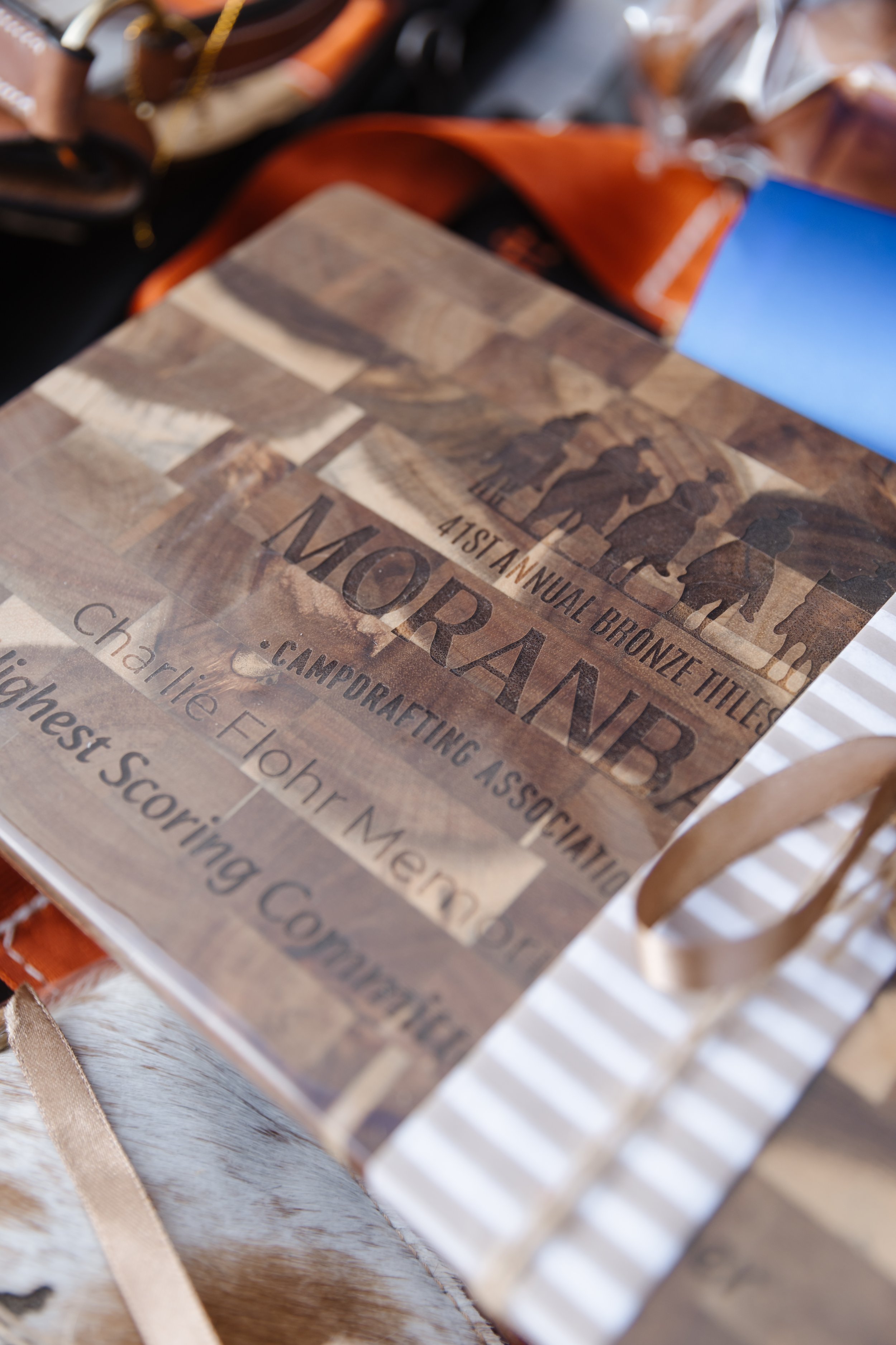 Close-up of a brochure or flyer for a business or event, with text mentioning the 41st Annual Bronze Titles and information about an organization or event.