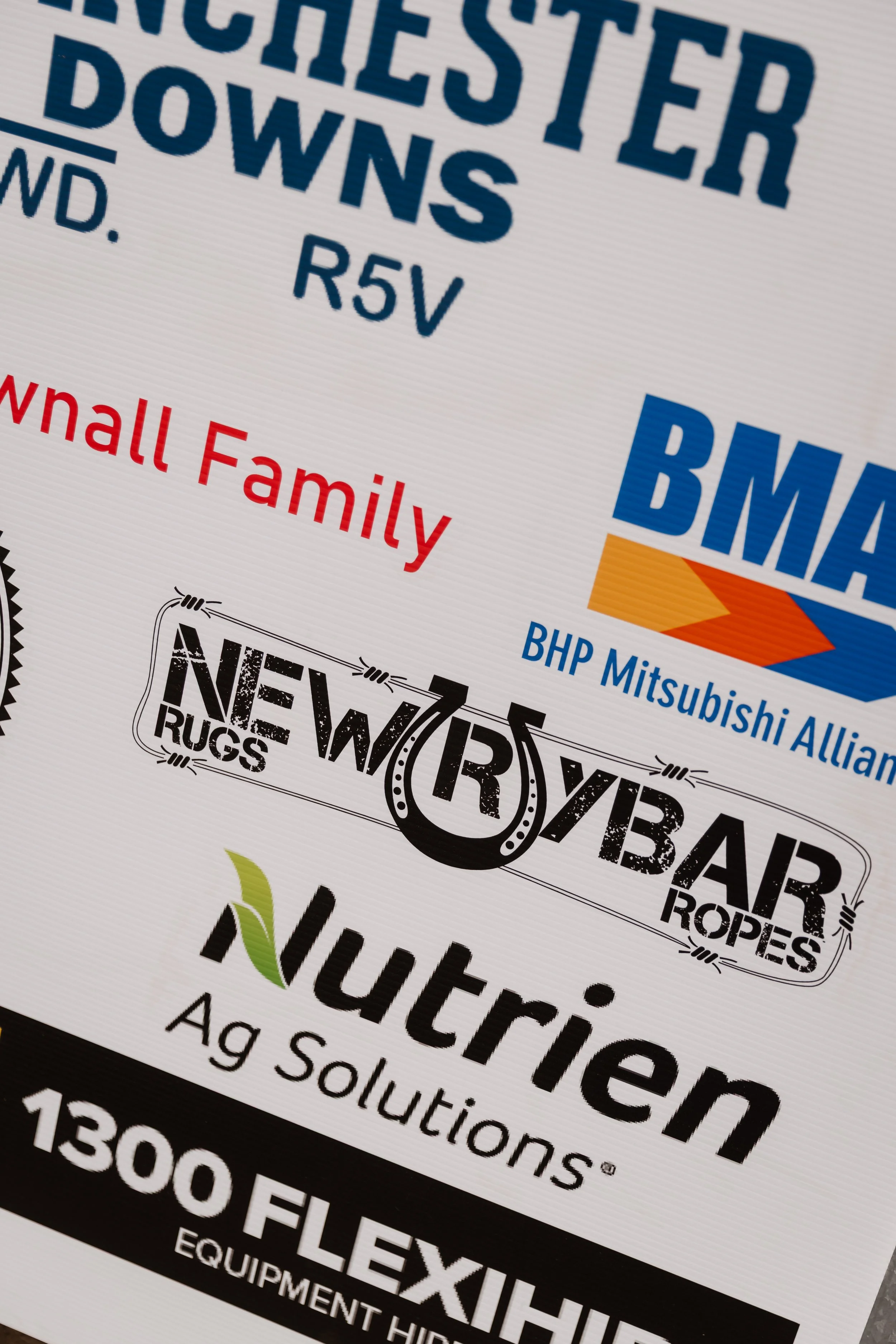 Close-up of a printed advertisement for Kawasaki bulk bags, including colorful logos and product descriptions.