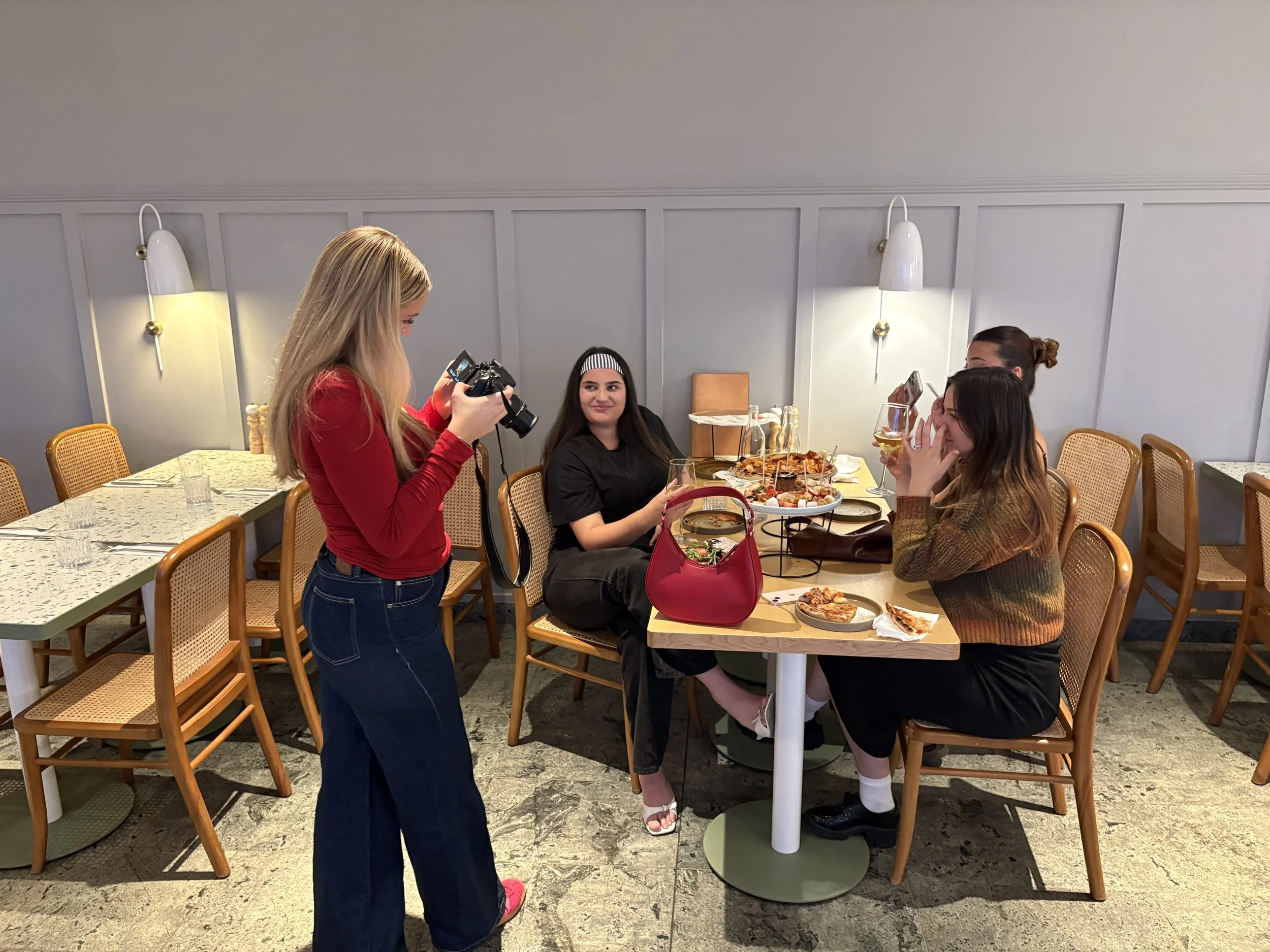The creation of an artwork by Estella Brasier Art. Based at Emu Hall, Emu Plains, Sydney Australian, depicting 3 girls having dinner and drinks together.