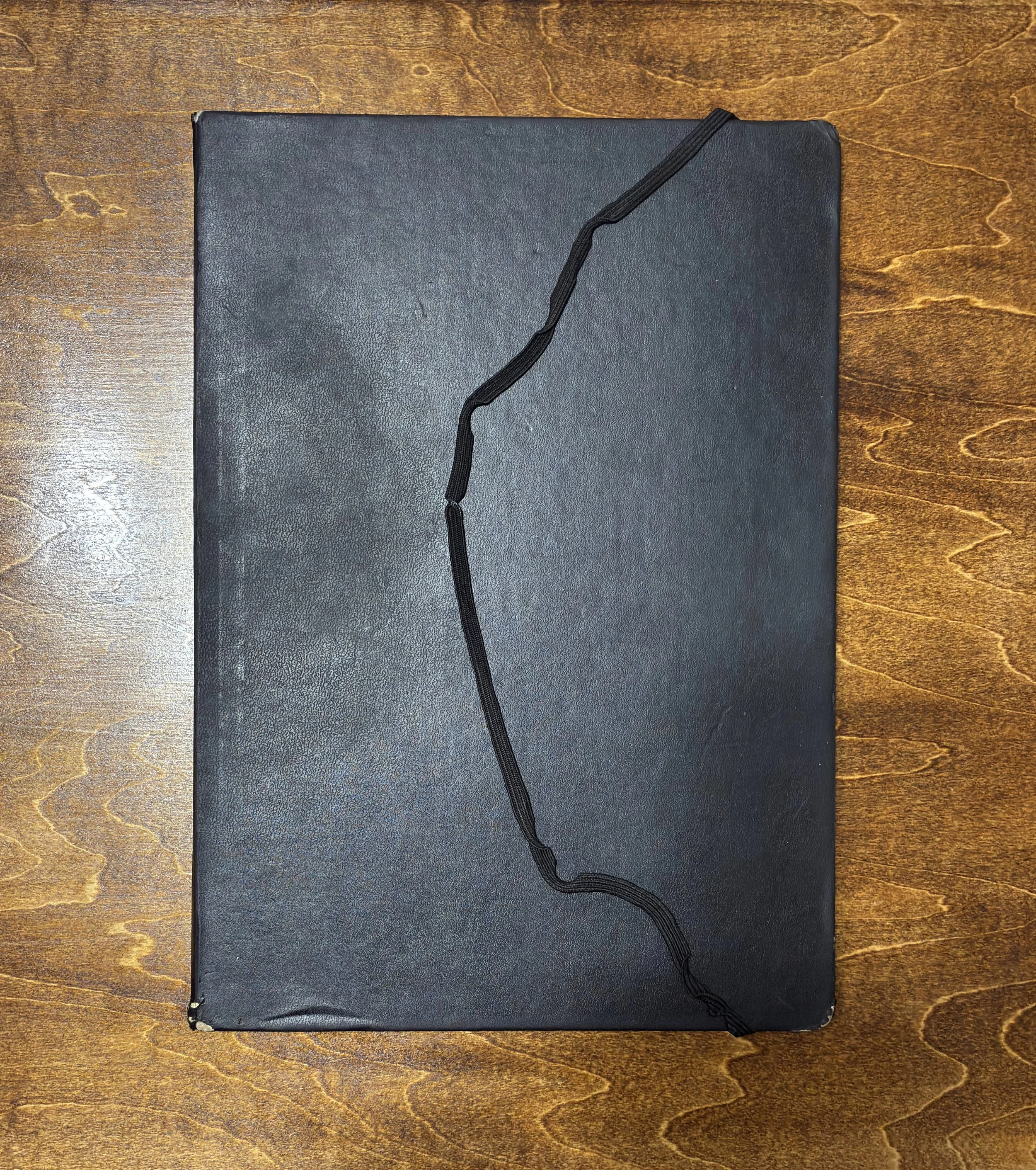 Kitāb al-Ṣabr (2011–2012) was discontinued after water damage and repeated tearing along the spine edges of the A4 Moleskine sketchbook made continued work in this format impractical. The damage on the final pages led to a reconsideration of material