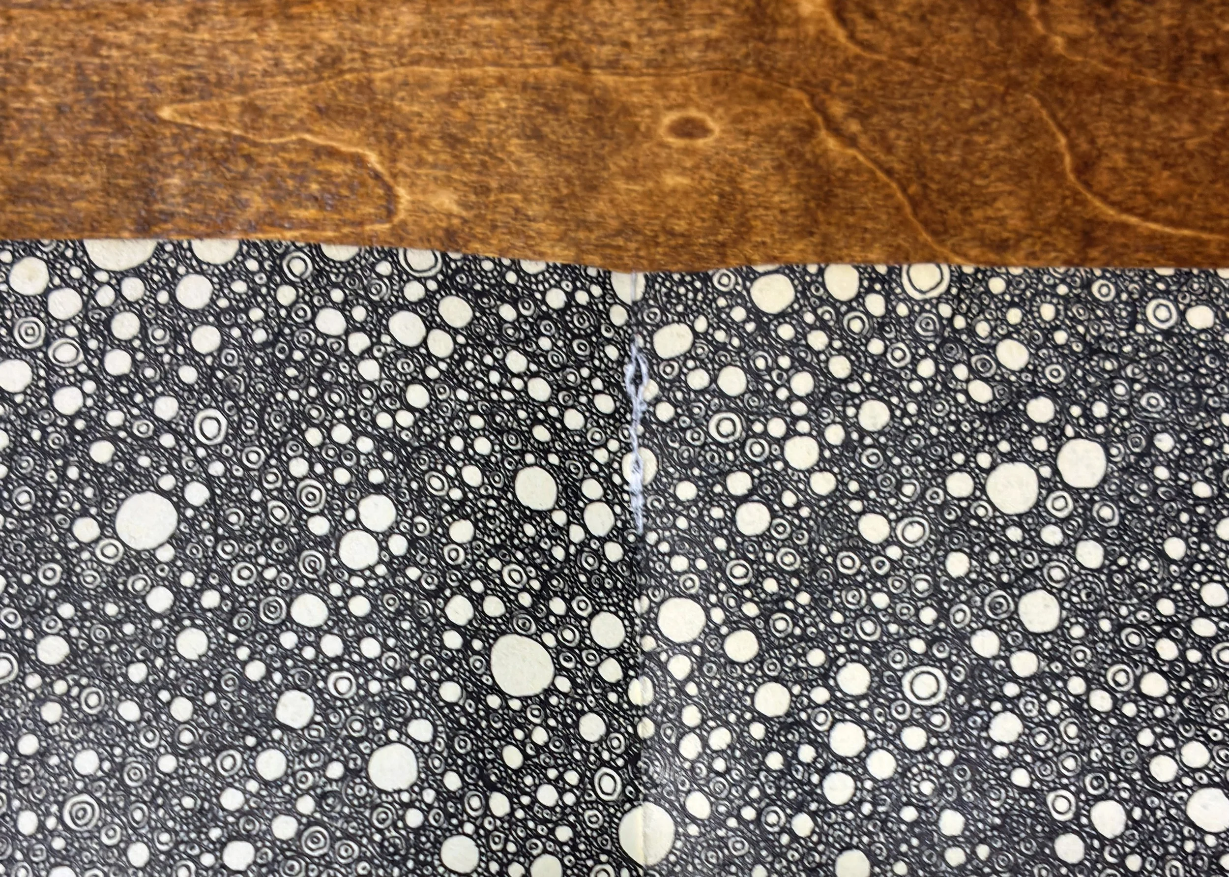 Detail of Kitāb al-Ṣabr showing tearing and paper failure along the spine edge. A4 Moleskine sketchbook (2011–2012).