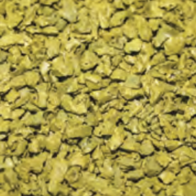 Close-up of crushed yellow material, possibly gravel or dried herbs.