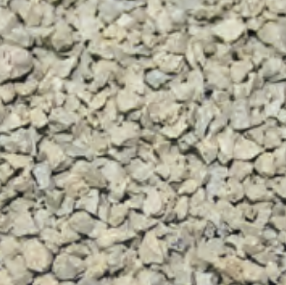 Close-up of small, light-colored gravel or crushed stones.