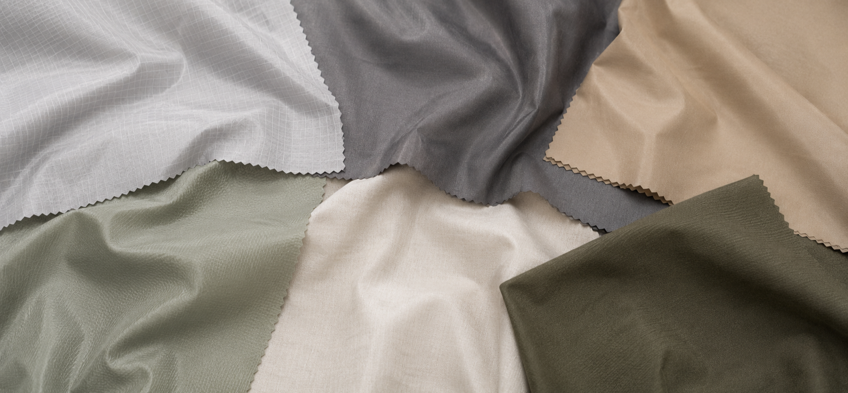 A variety of fabric swatches in colors including white, gray, beige, green, and cream, displayed with textures ranging from smooth to patterned.