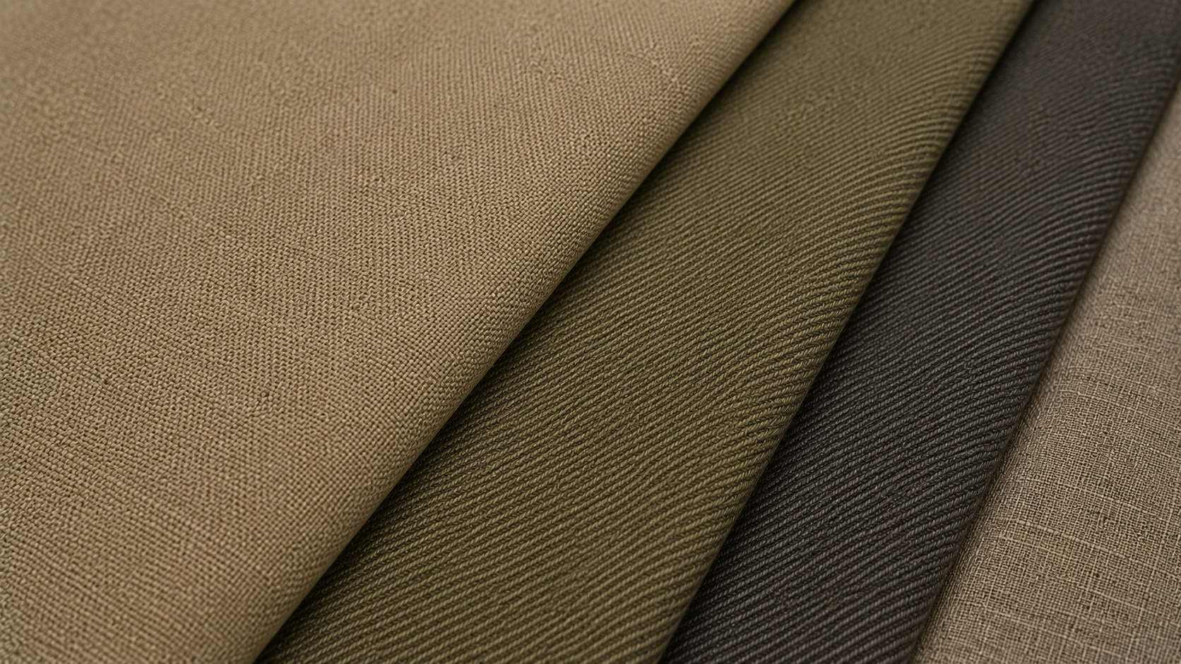 Fabrics in shades of beige, brown, and green laid out in overlapping layers.