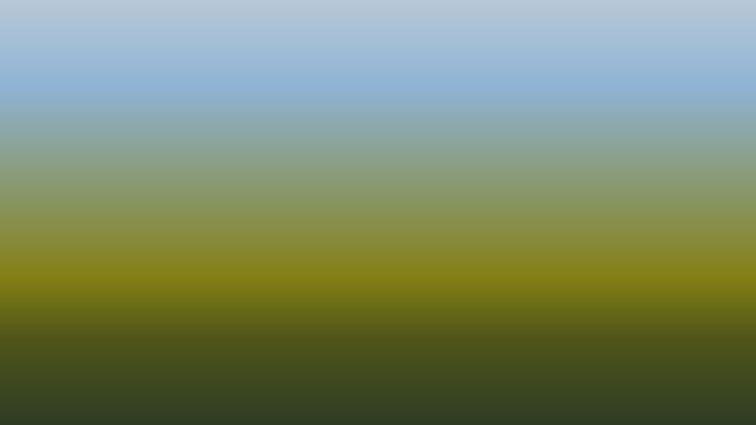 A blurred outdoor landscape with a green and blue color gradient.