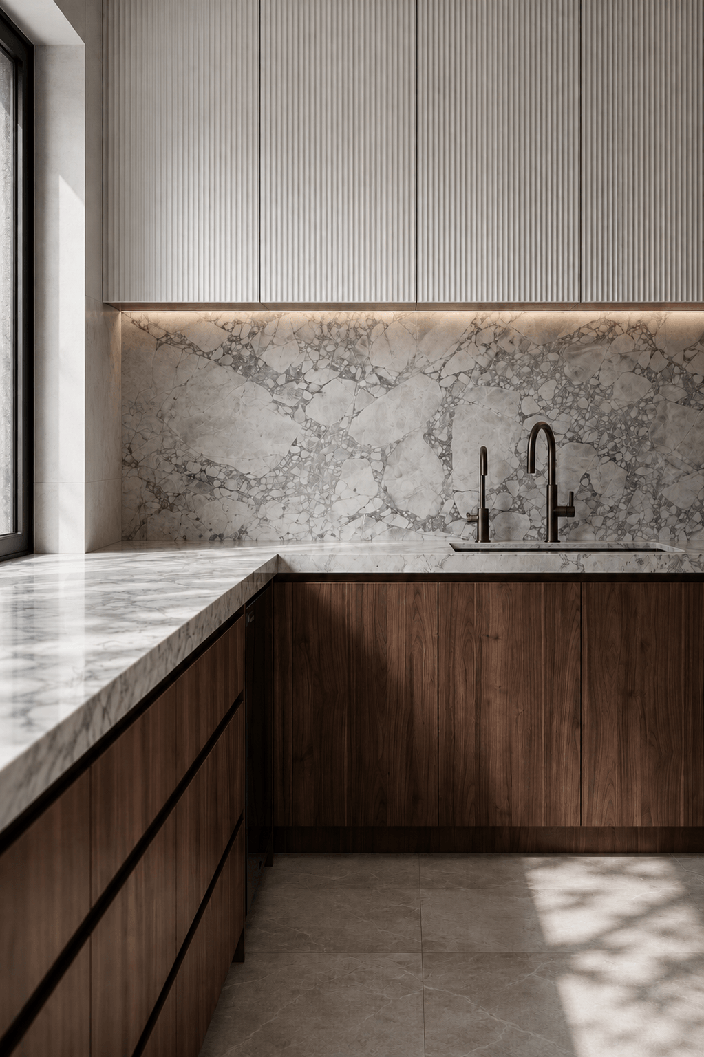 Modern kitchen with marble countertops, marble backsplash with gray veining, dark wood cabinetry, black faucet, and ample natural light.