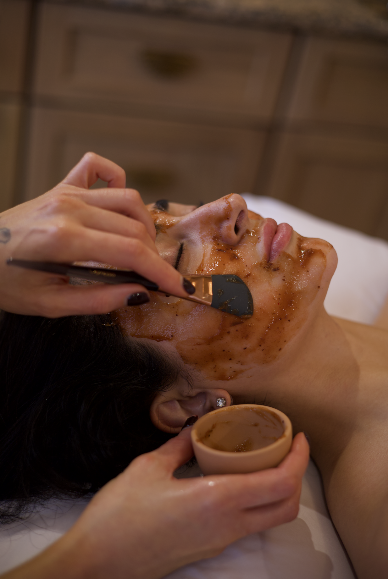 Customized facial treatment and mask application at Salt & Rind in La Jolla.