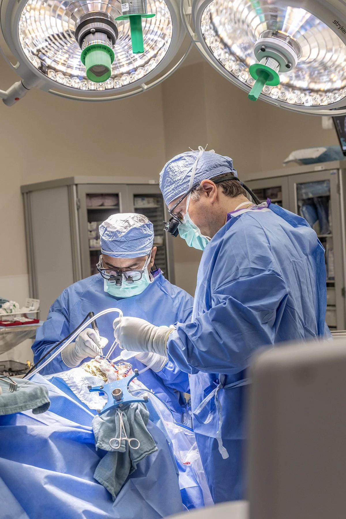 Neurosurgical resection of a brain tumor using advanced microsurgical techniques and intraoperative visualization.