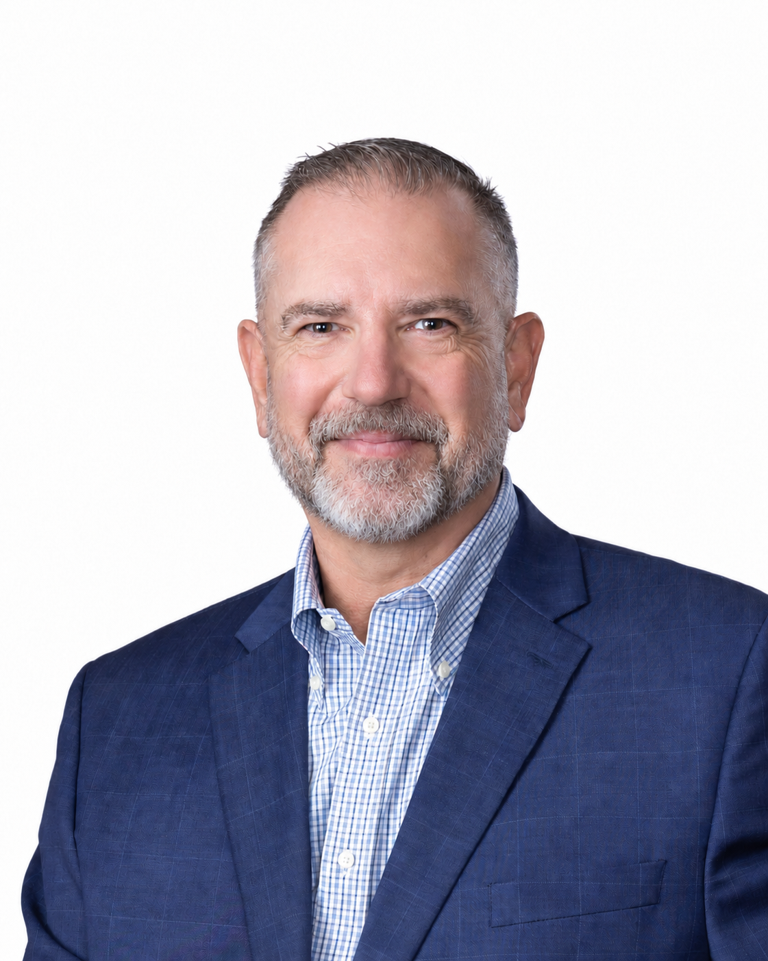 Professional portrait of Ben Wolcott wearing a blue checked shirt and blue suit with a neatly groomed grey beard.