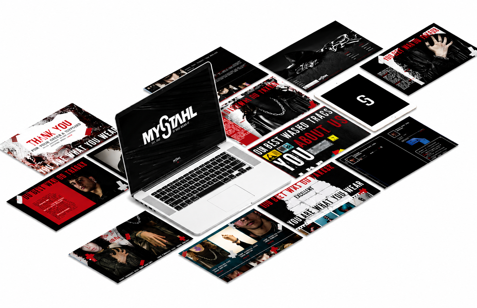 A silver MacBook laptop surrounded by various posters and digital screens with black, red, and white designs and text.