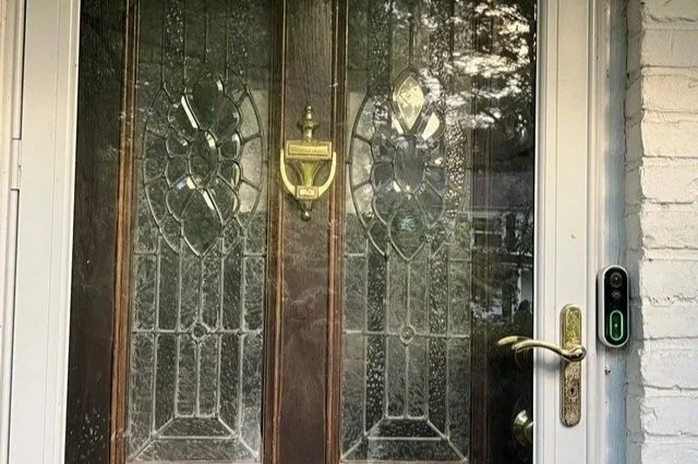 front door of house with doorbell camera