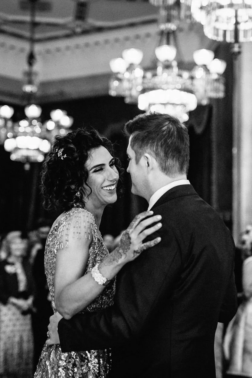 Black and white image of bride and groom doing first dance