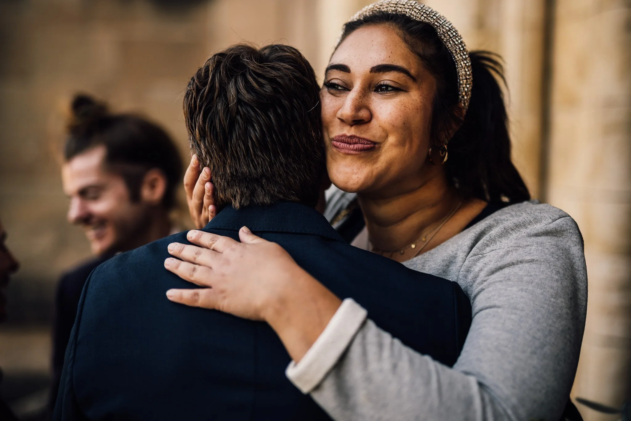  Wedding guest hugging the groom 