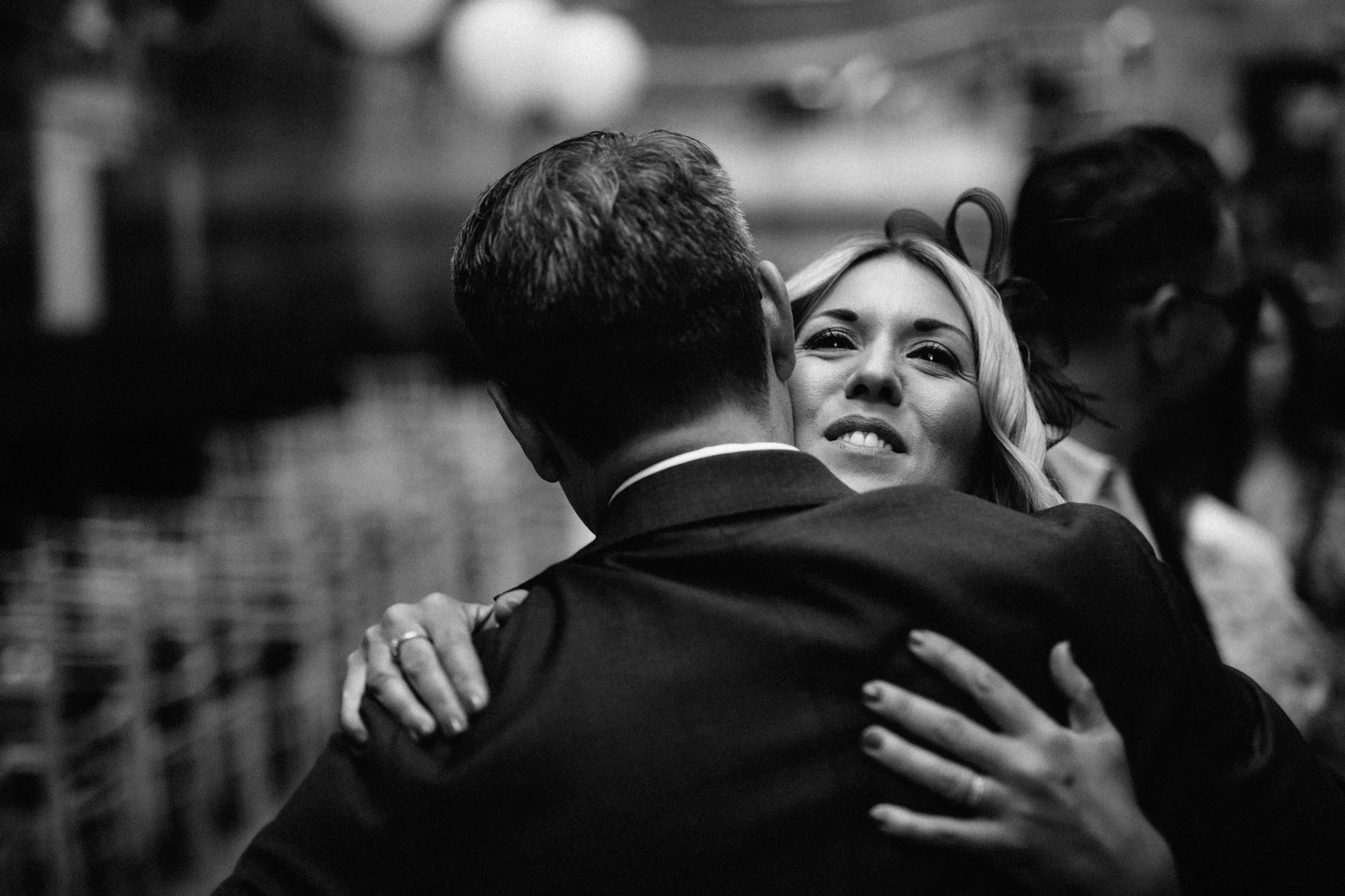  Wedding guest hugs the groom 