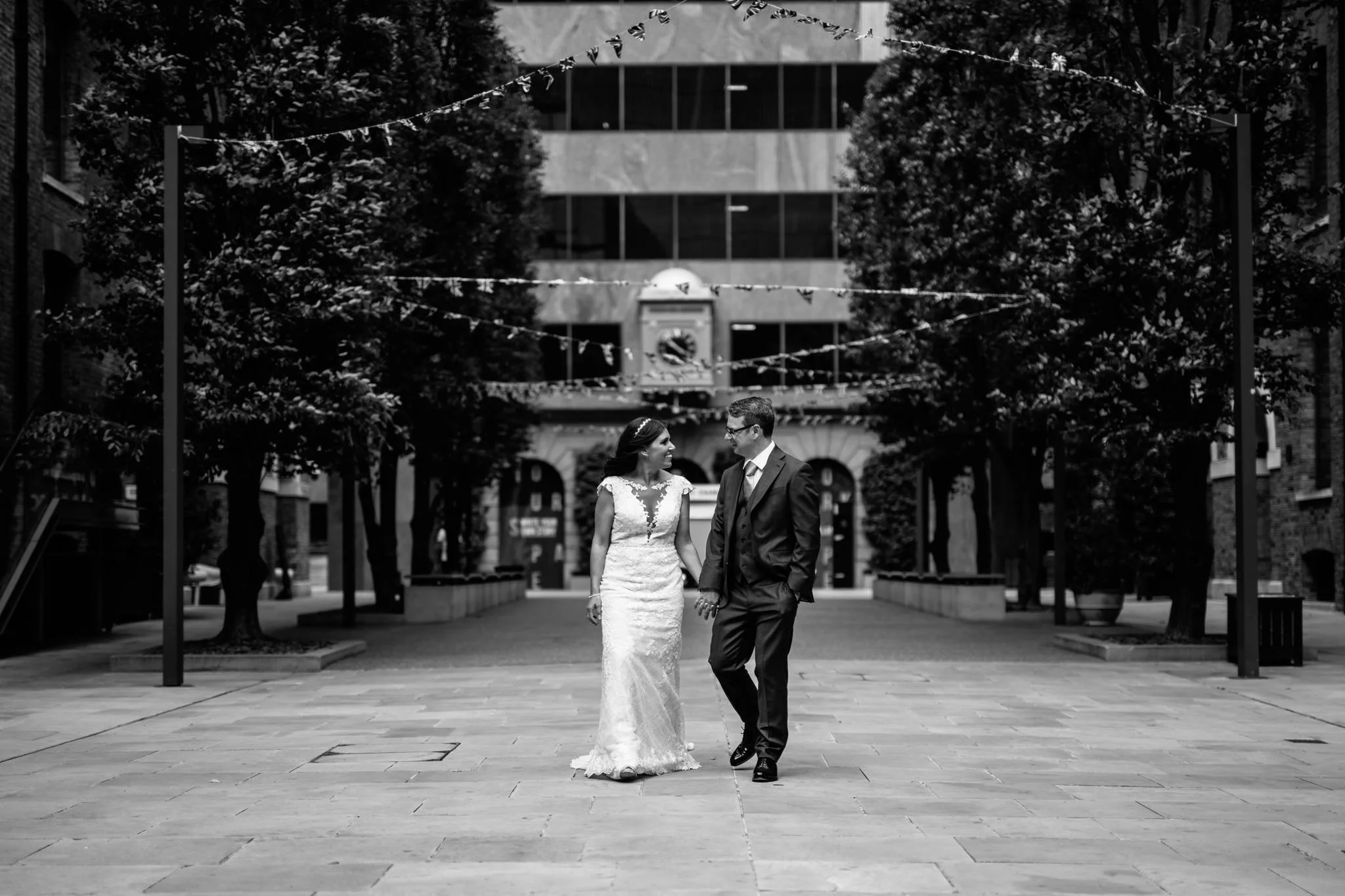  Bride and Groom walking whilst holding hands 