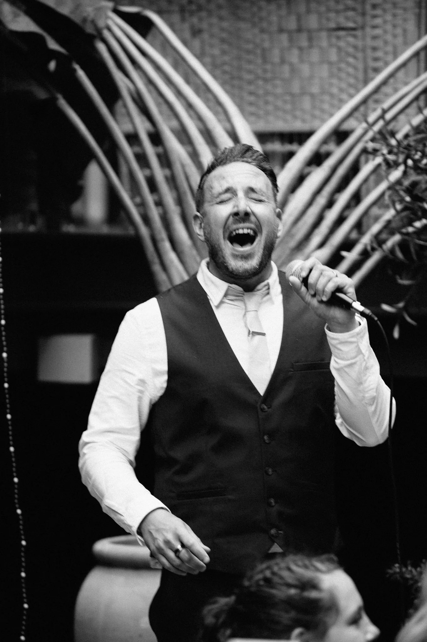  One of the wedding guests singing 