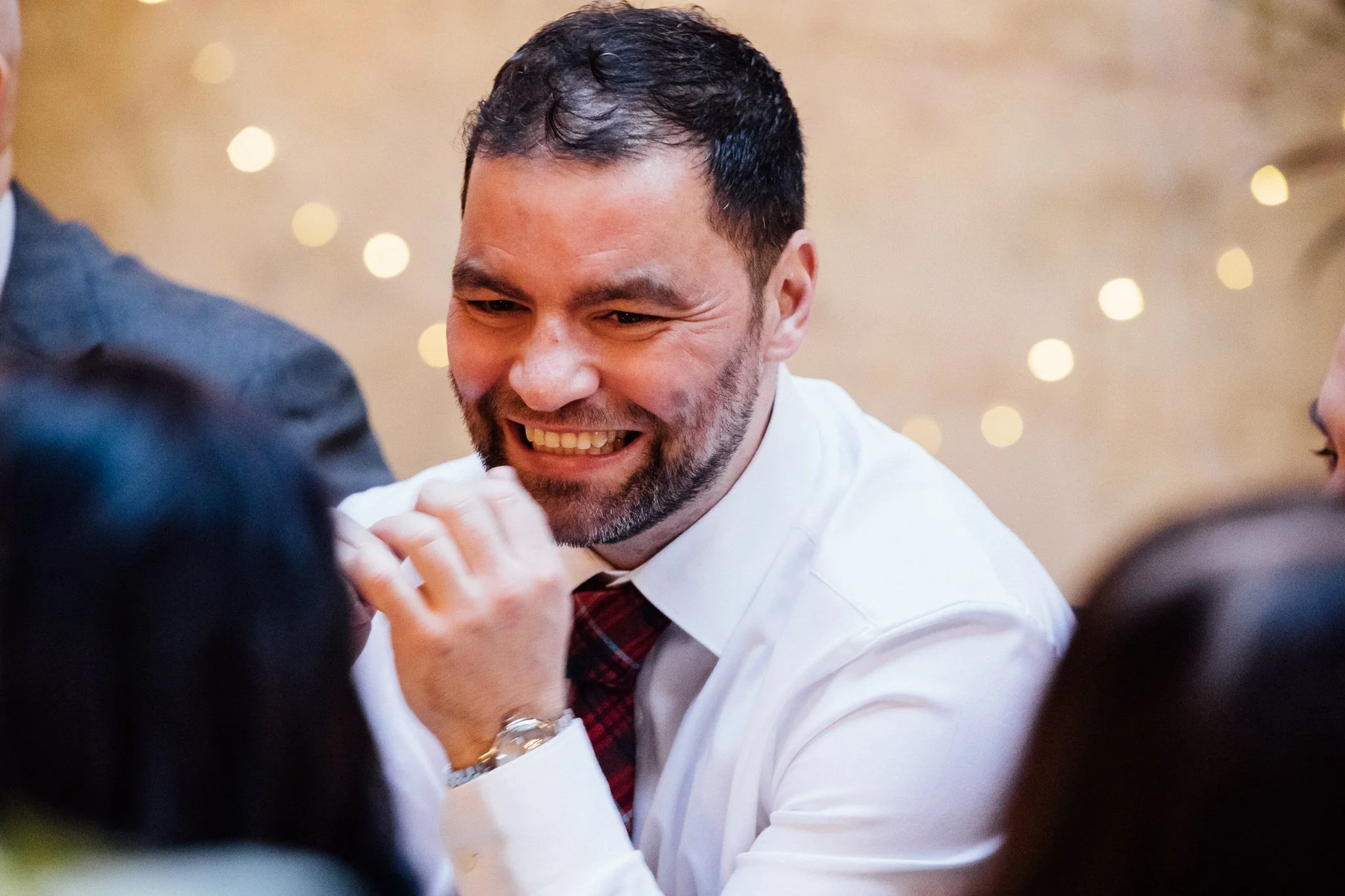  Wedding guest laughing during the wedding breakfast at the Bull and Gate 