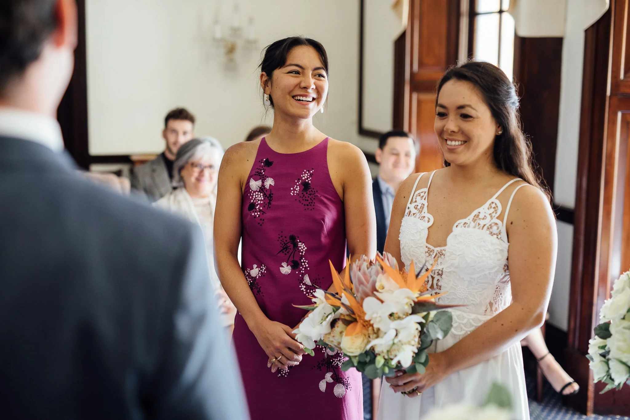  Maid of honour smiling during the ceremony 