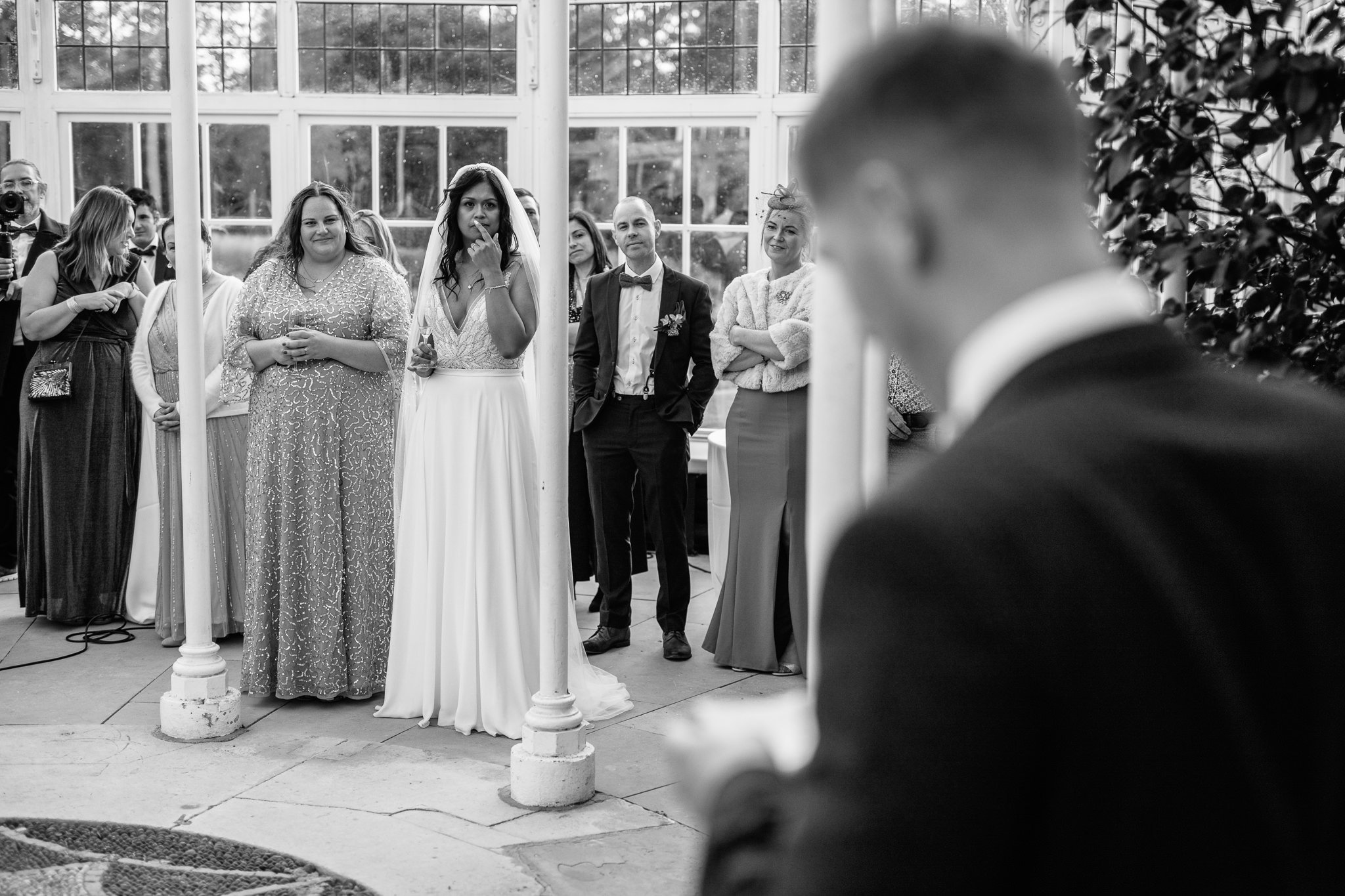  Bride listens to the Groom’s speech at Chiswick House and Gardens 