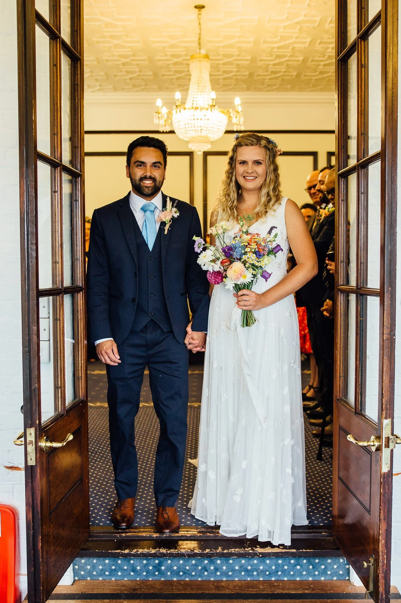  Bride and Groom exiting the ceremony room at Leatherhead Register Office 
