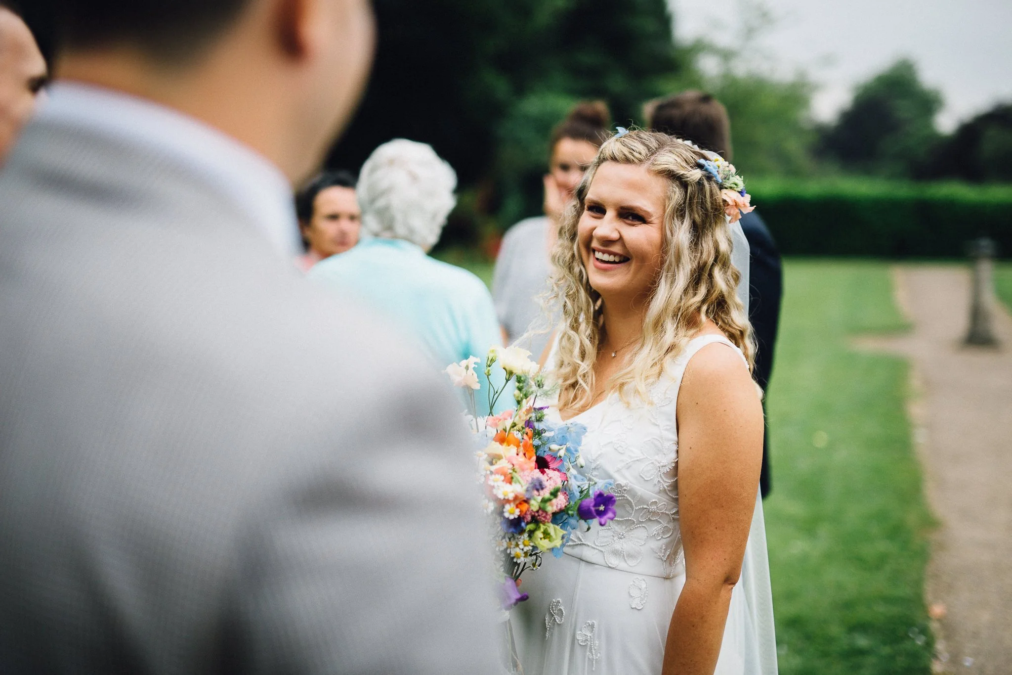  Bride laughing in the gardens at Leatherhead Register Office 