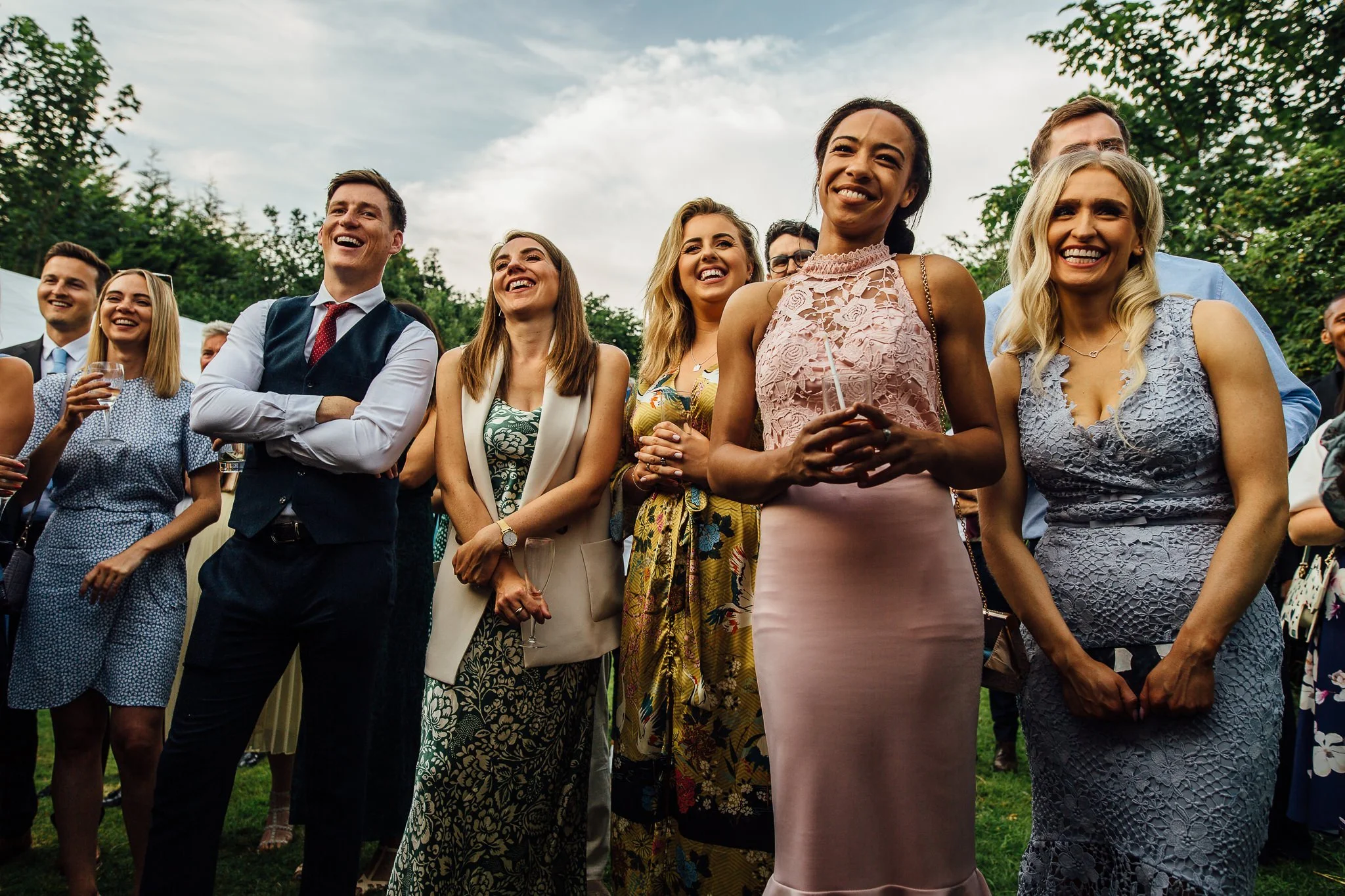  Guests laughing and smiling during the speeches 