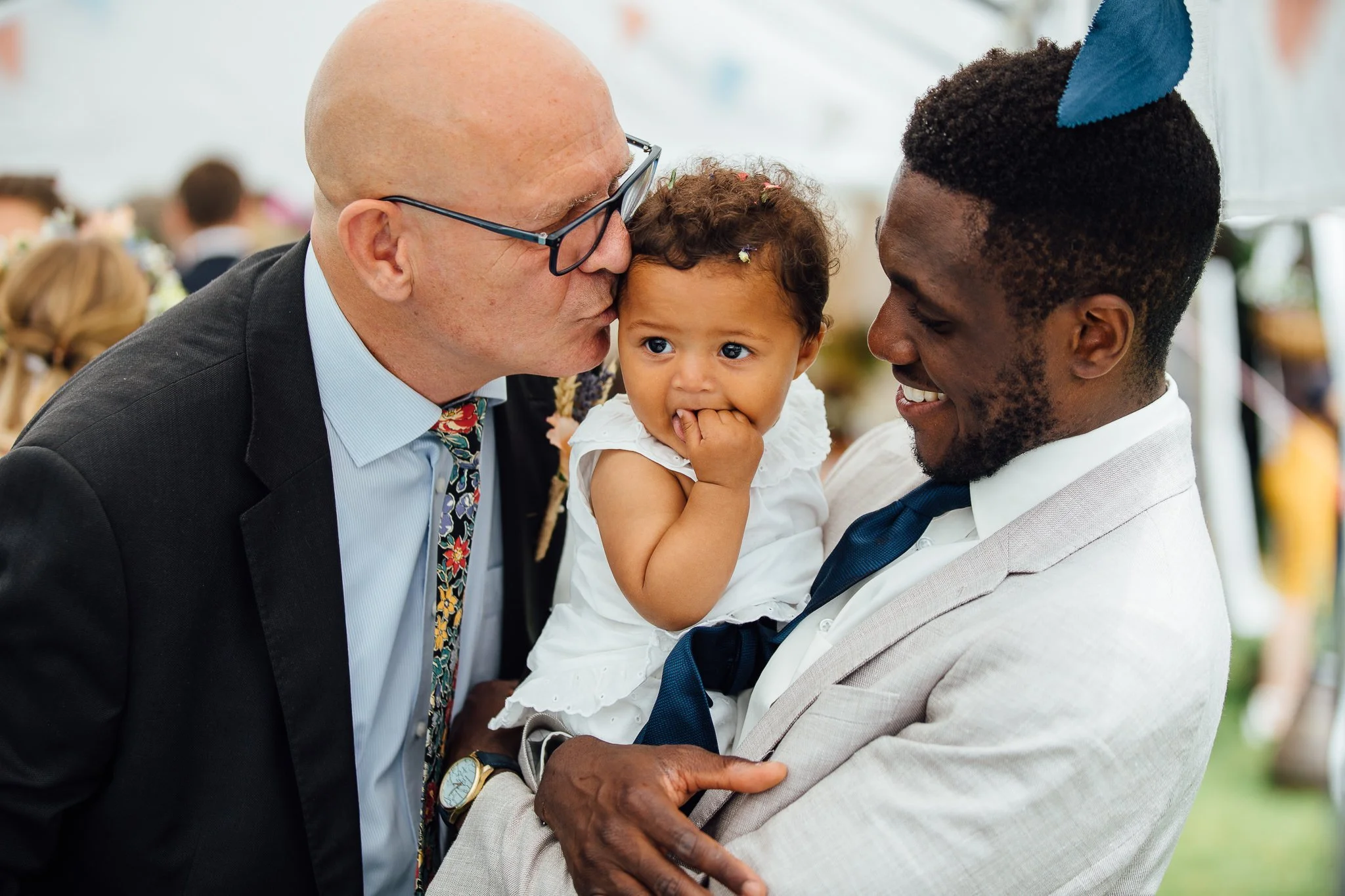  Man kisses a baby 