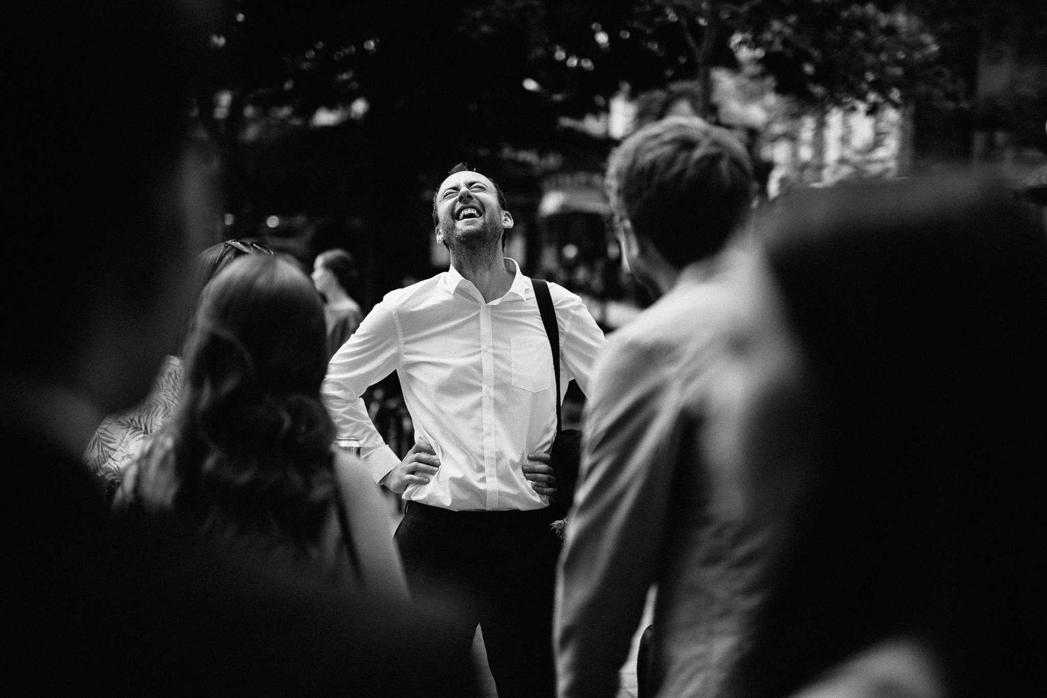 Wedding guest laughing outside  Islington Town Hall 