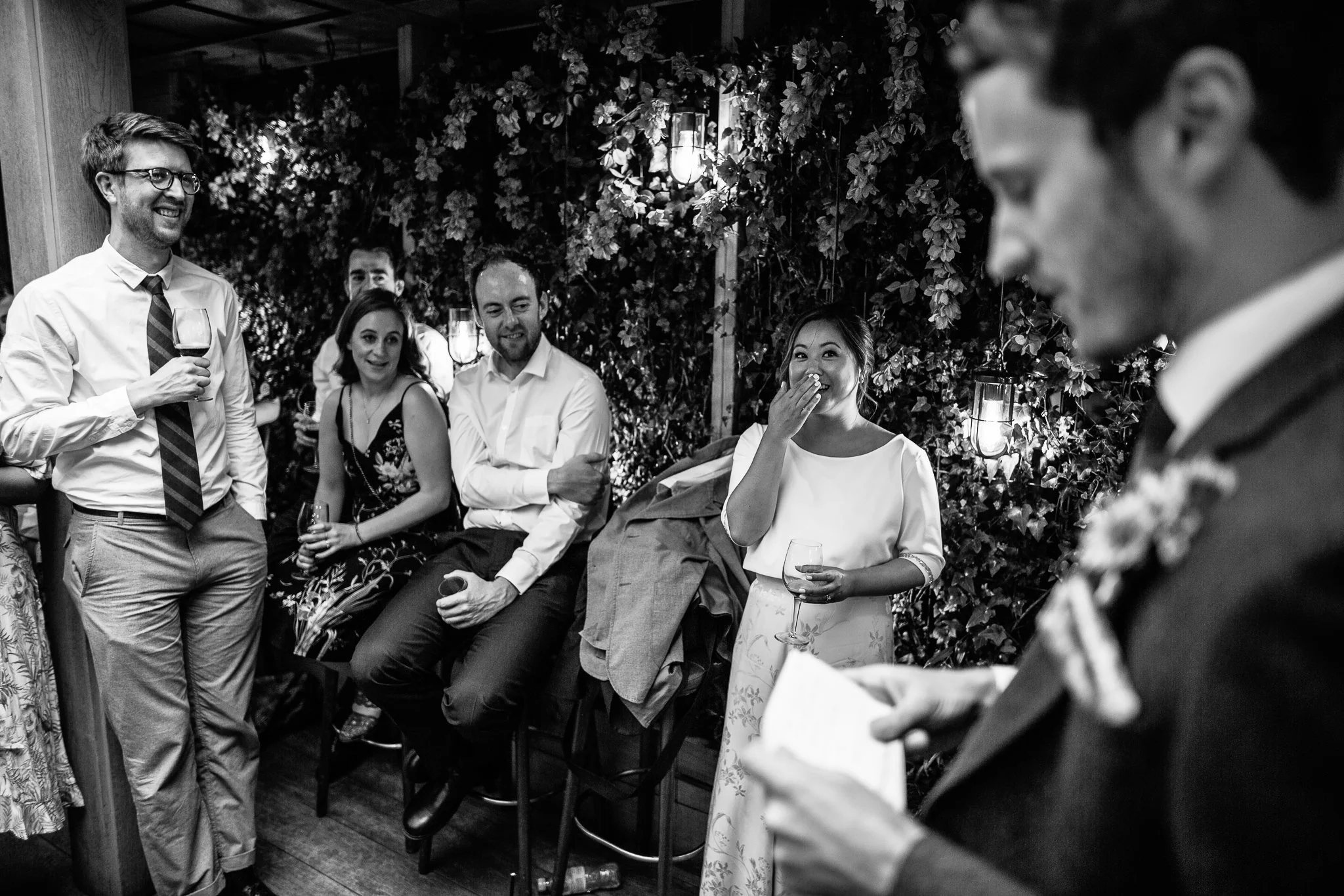  Bride laughing during the wedding speeches 