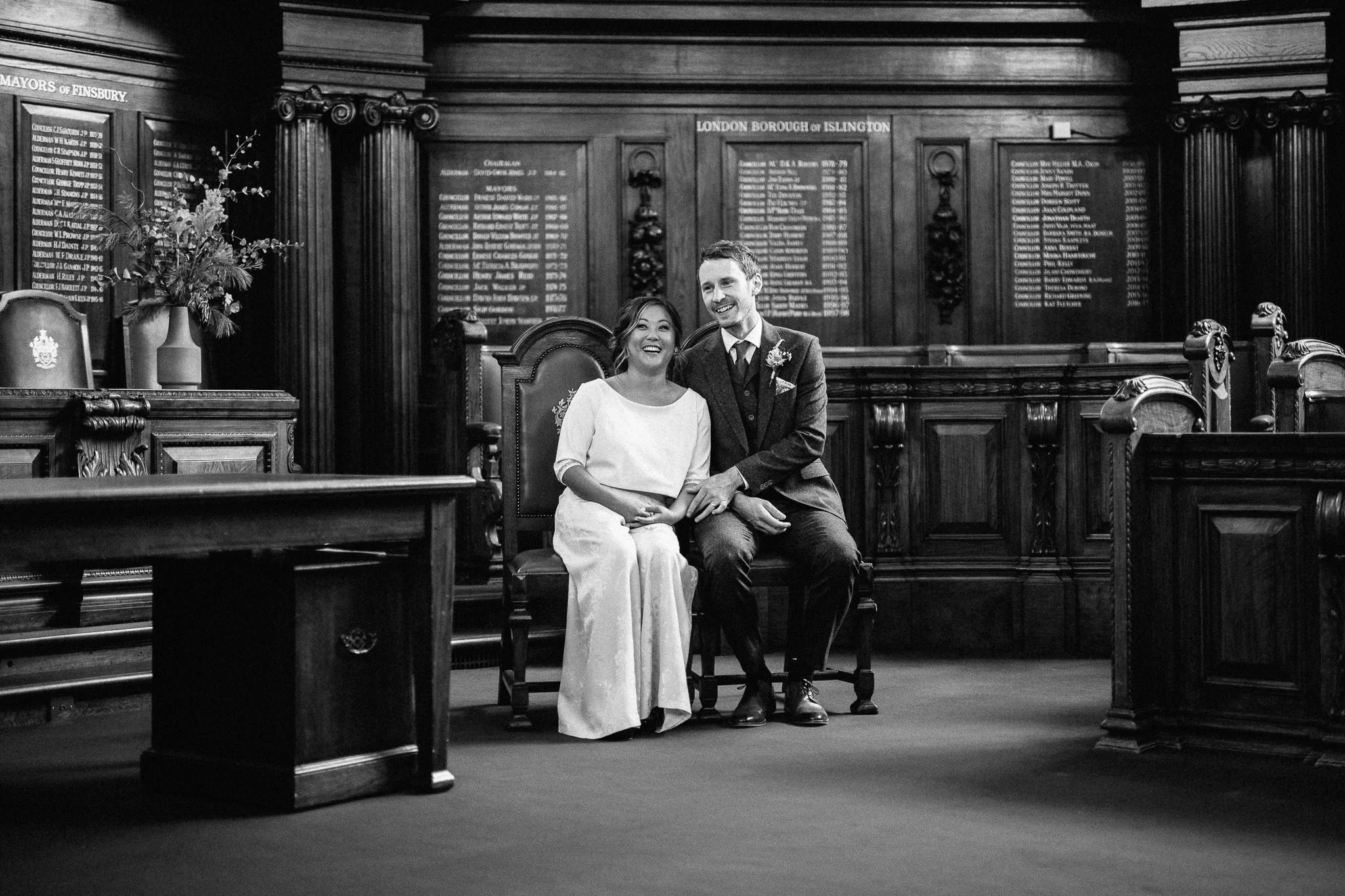  Bride and Groom in the council chambers after their wedding at  Islington Town Hall 