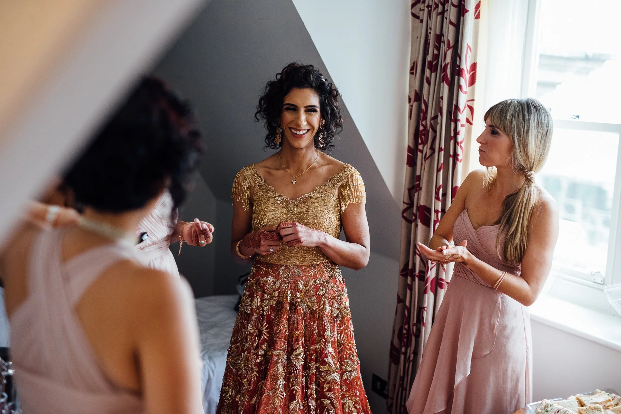  Bride smiling with her bridesmaids at One Whitehall Place 