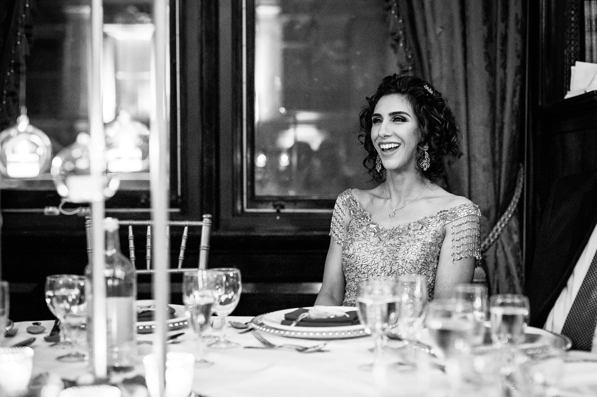  Bride smiling during the speeches at One Whitehall Place 