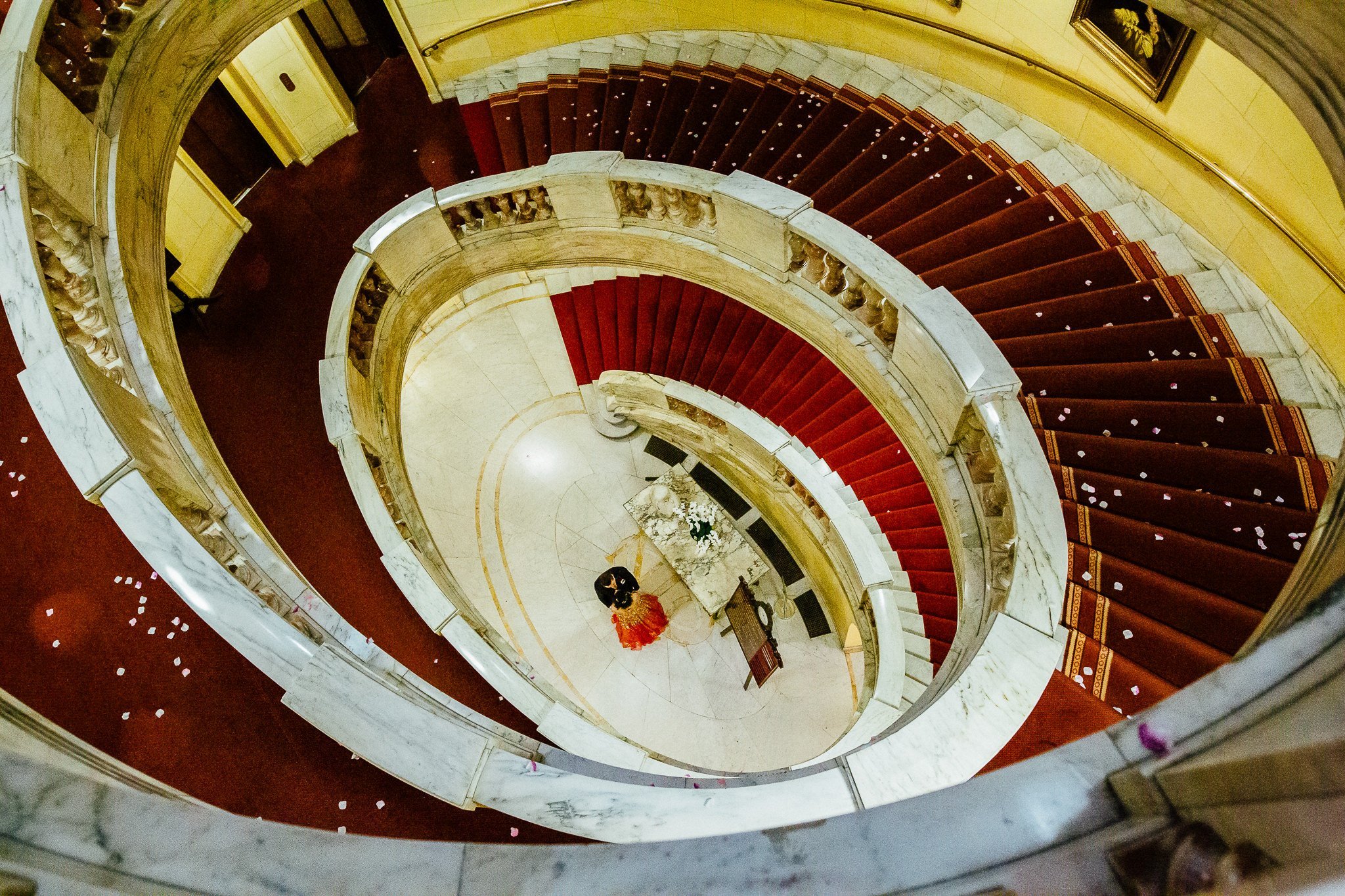 Bride and Groom at the bottom of the grand staircase at One Whitehall Place 