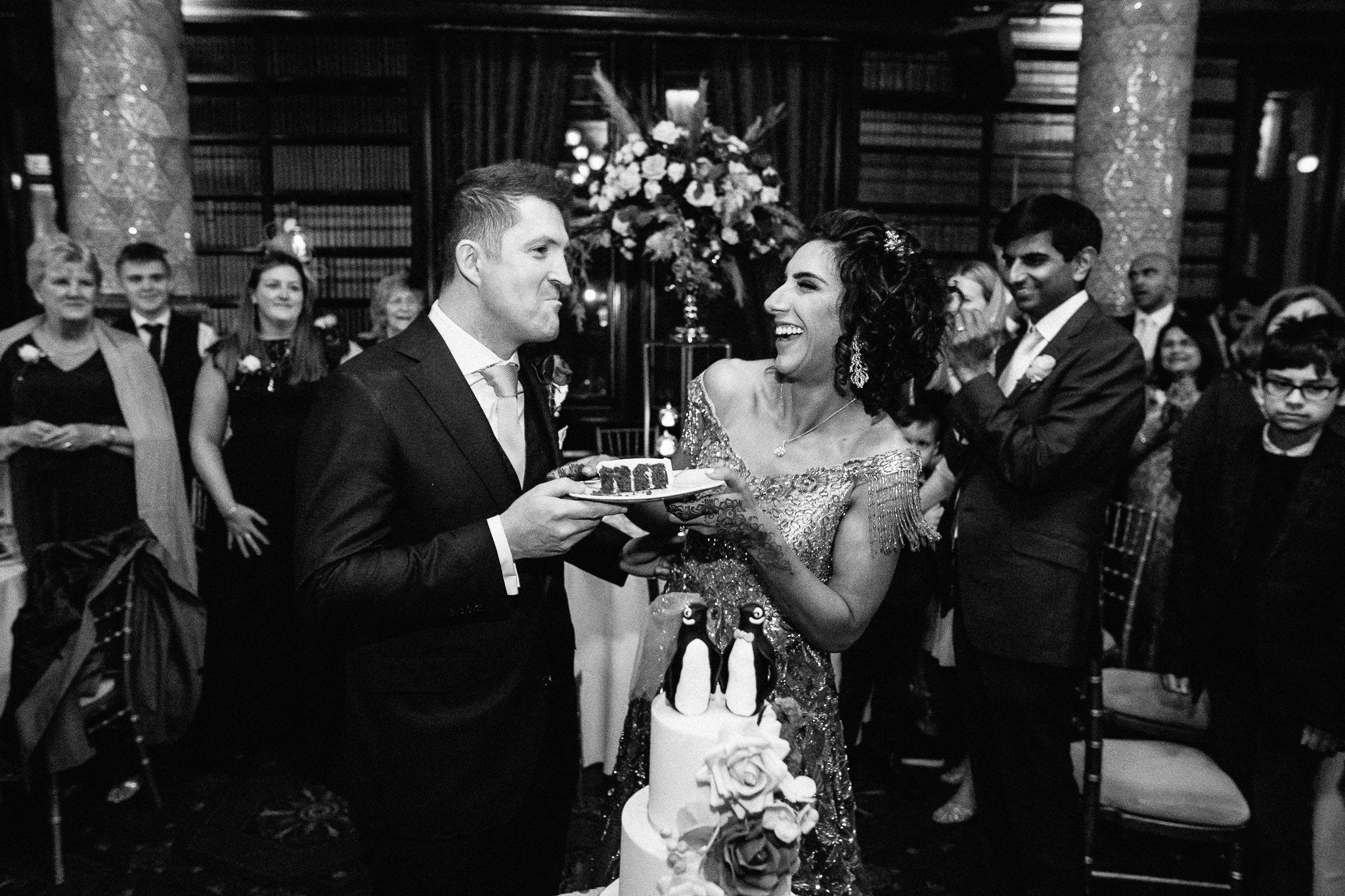  Bride and Groom feeding each other cake at One Whitehall Place London 