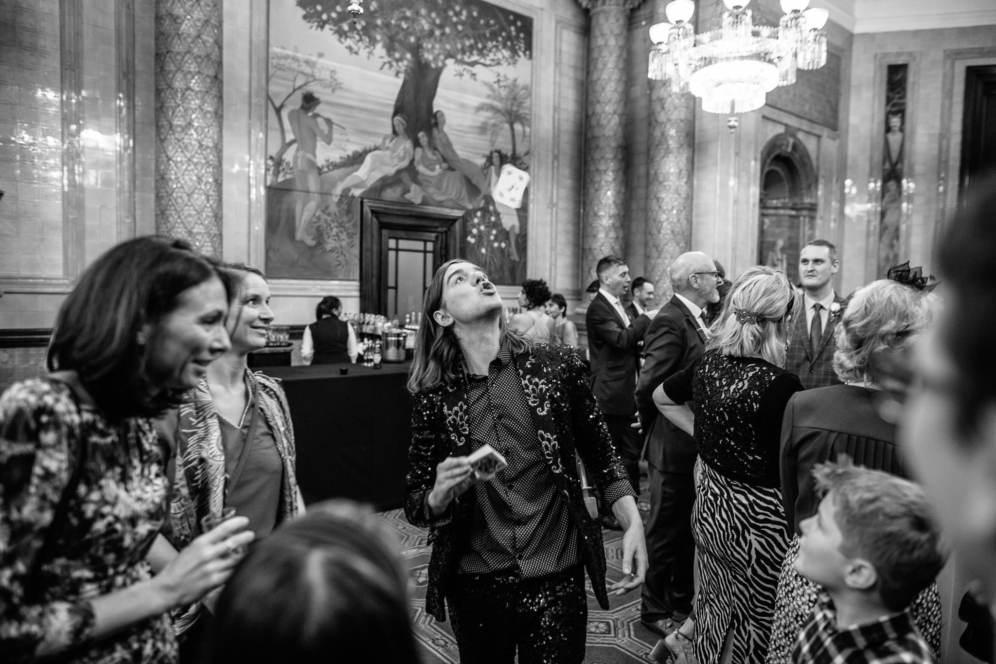  Magician throwing a playing card at One Whitehall Place London 