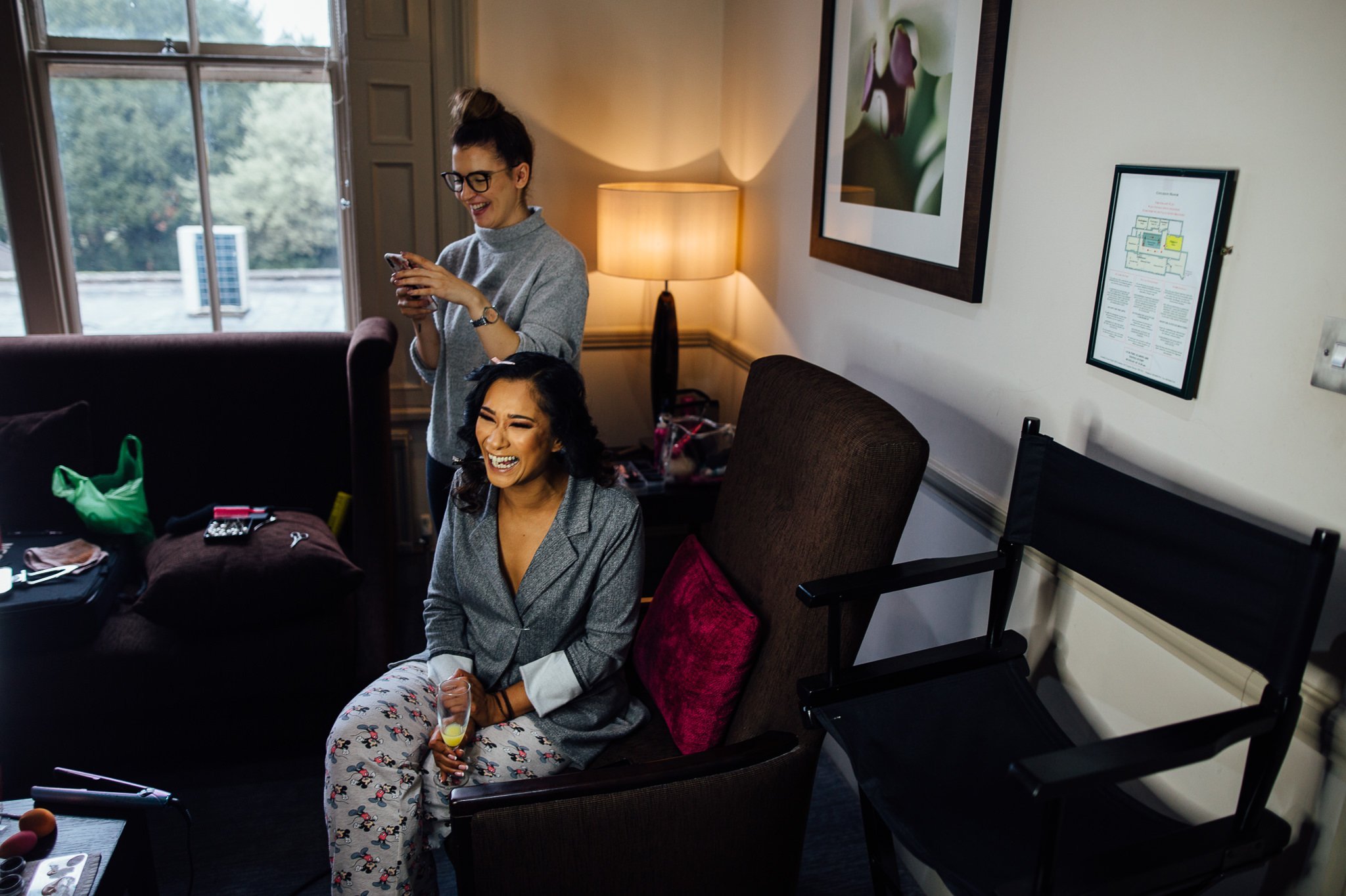  Bride getting ready in a room at Coulsdon Manor Hotel 