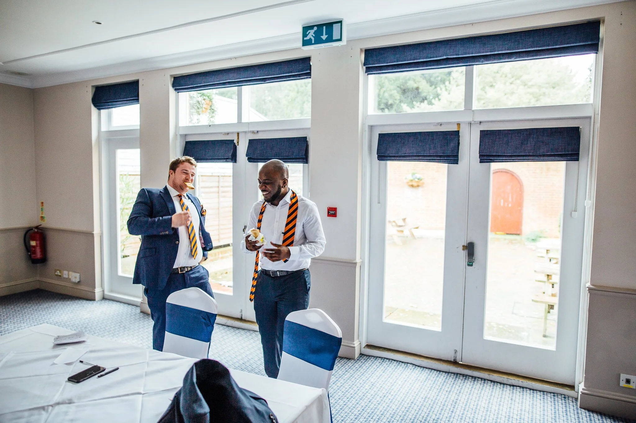  Groomsmen eating food at Coulsdon Manor Hotel 