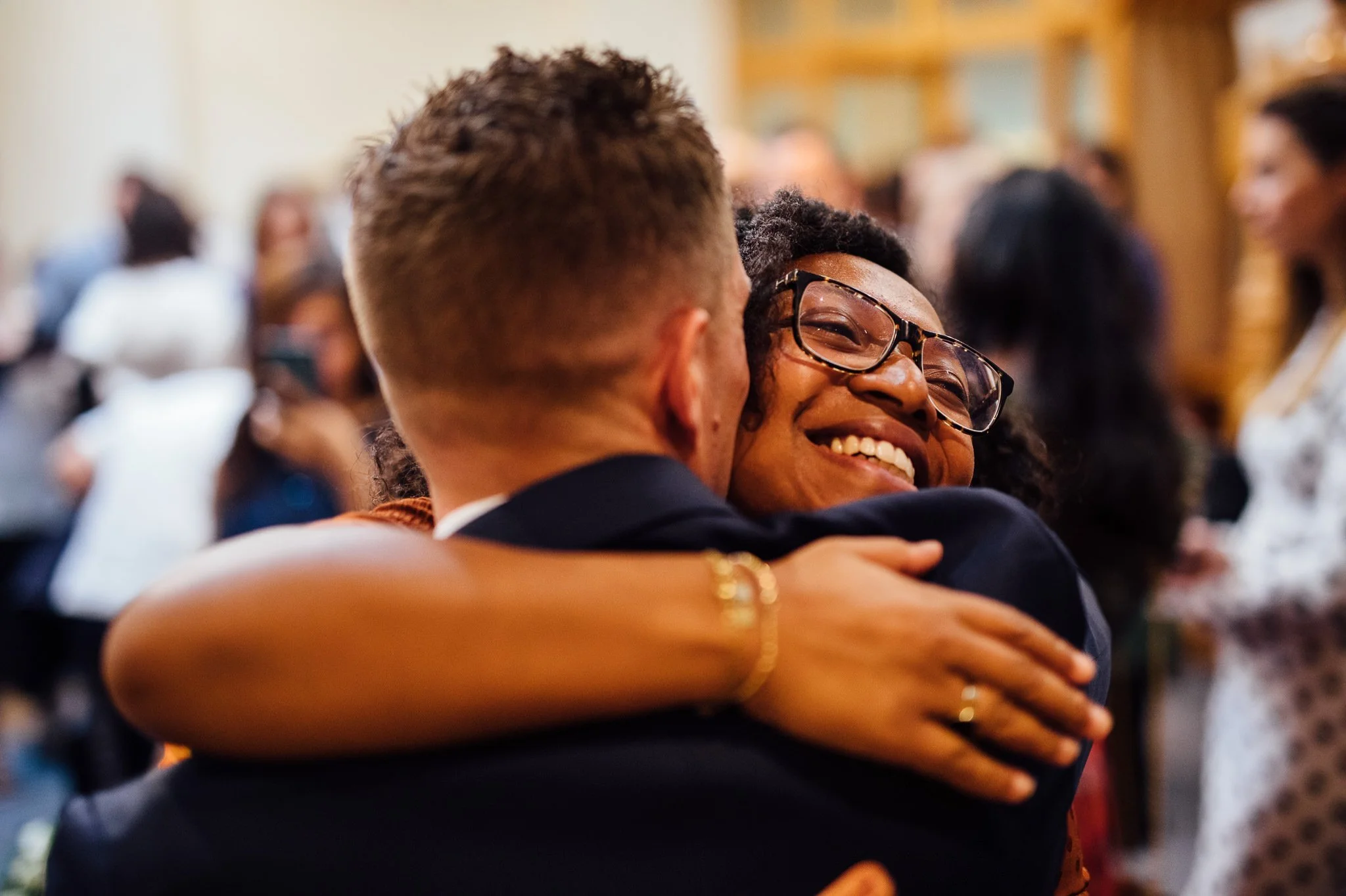  Groom hugging a wedding guest 