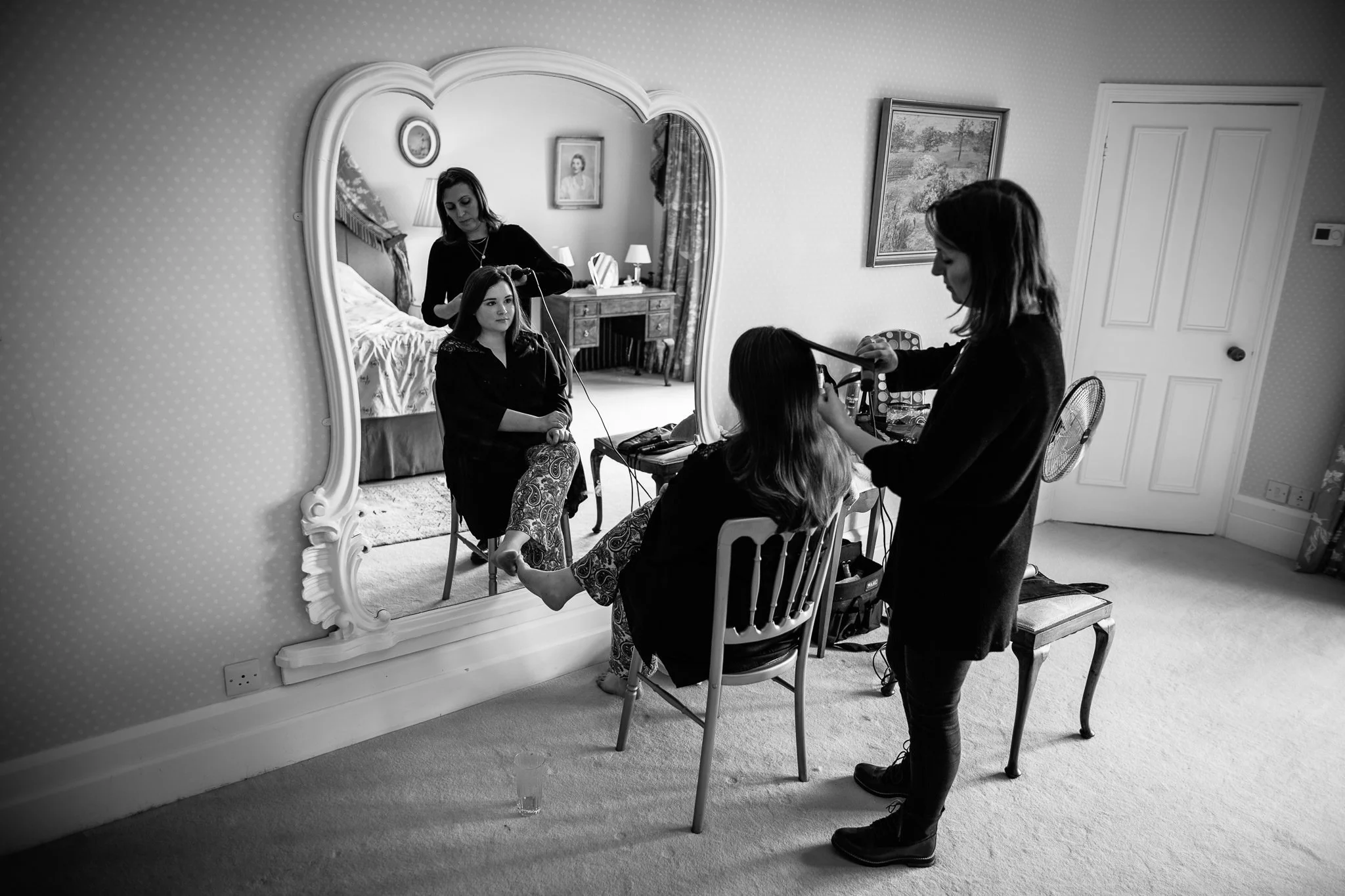  Bride looking in the mirror on her wedding day at Wadhurst Castle 
