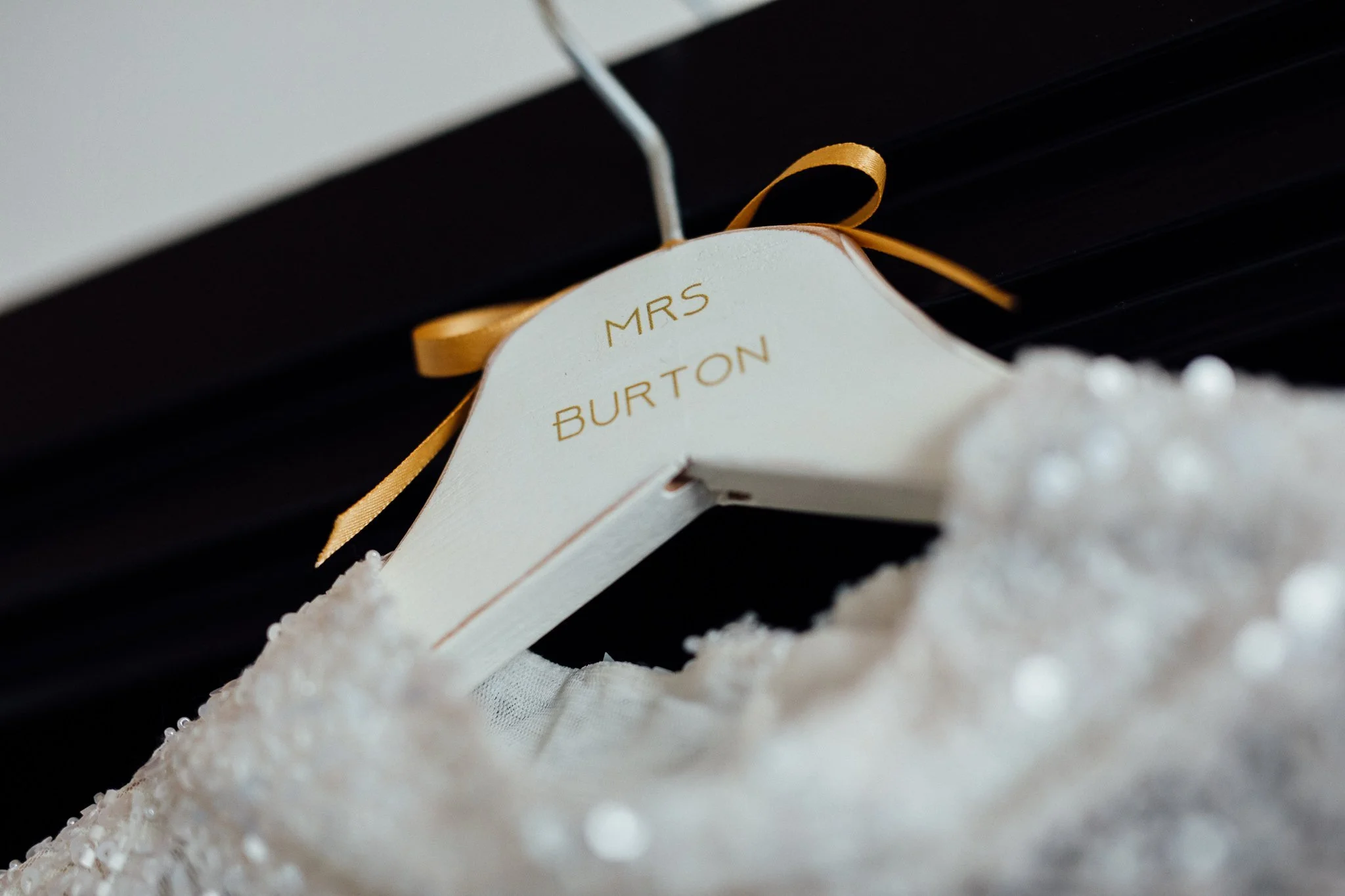  A hanger displaying the name of the bride 