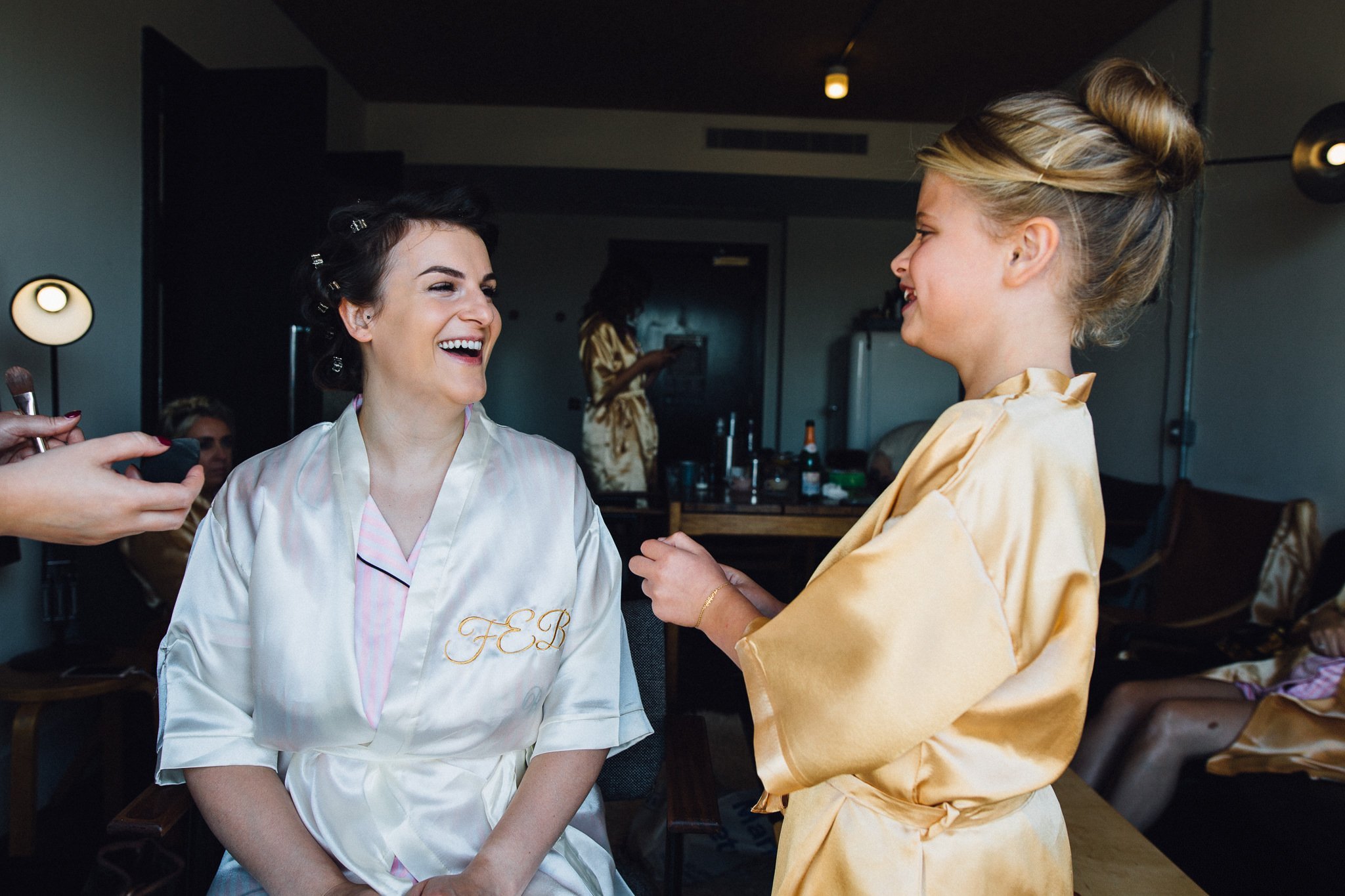  Bride laughing with friends daughter 