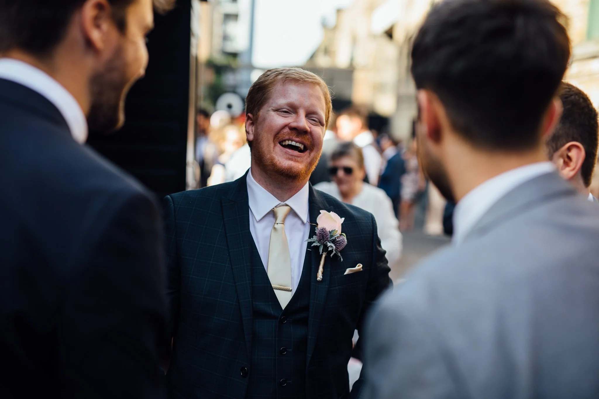  Groom laughing. 