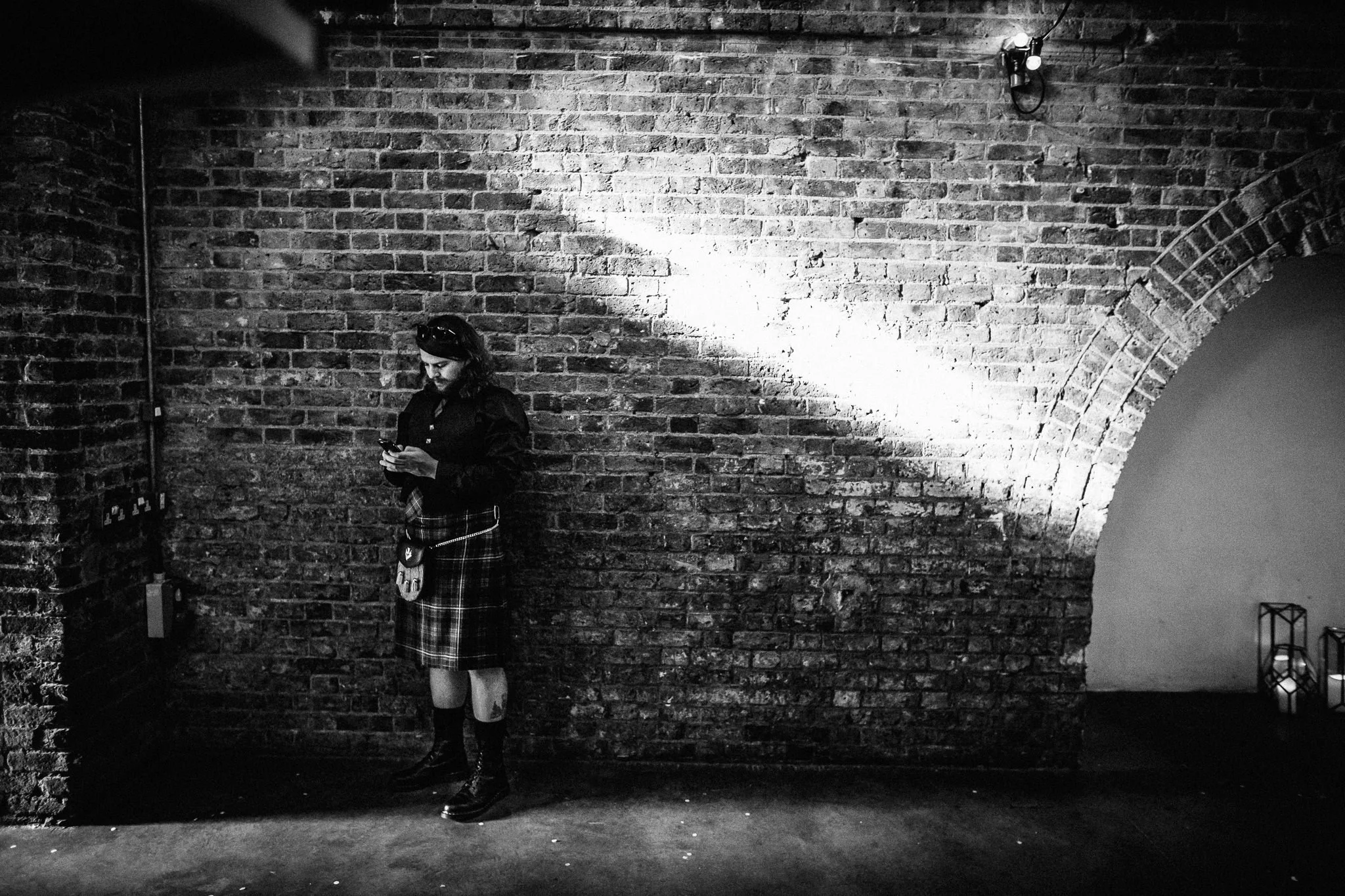  Guest leaning against a wall 