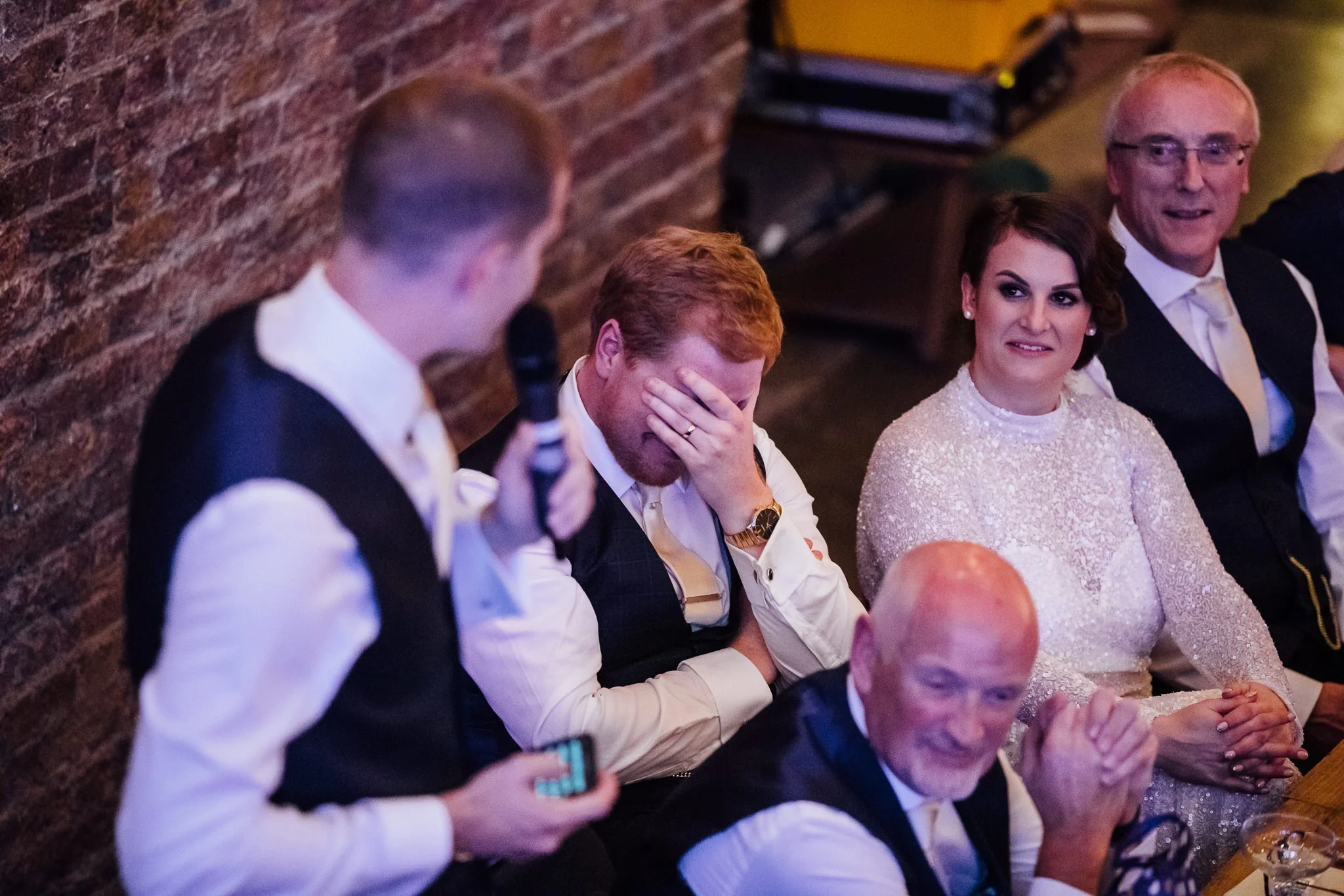  Groom with his head in his hands. 